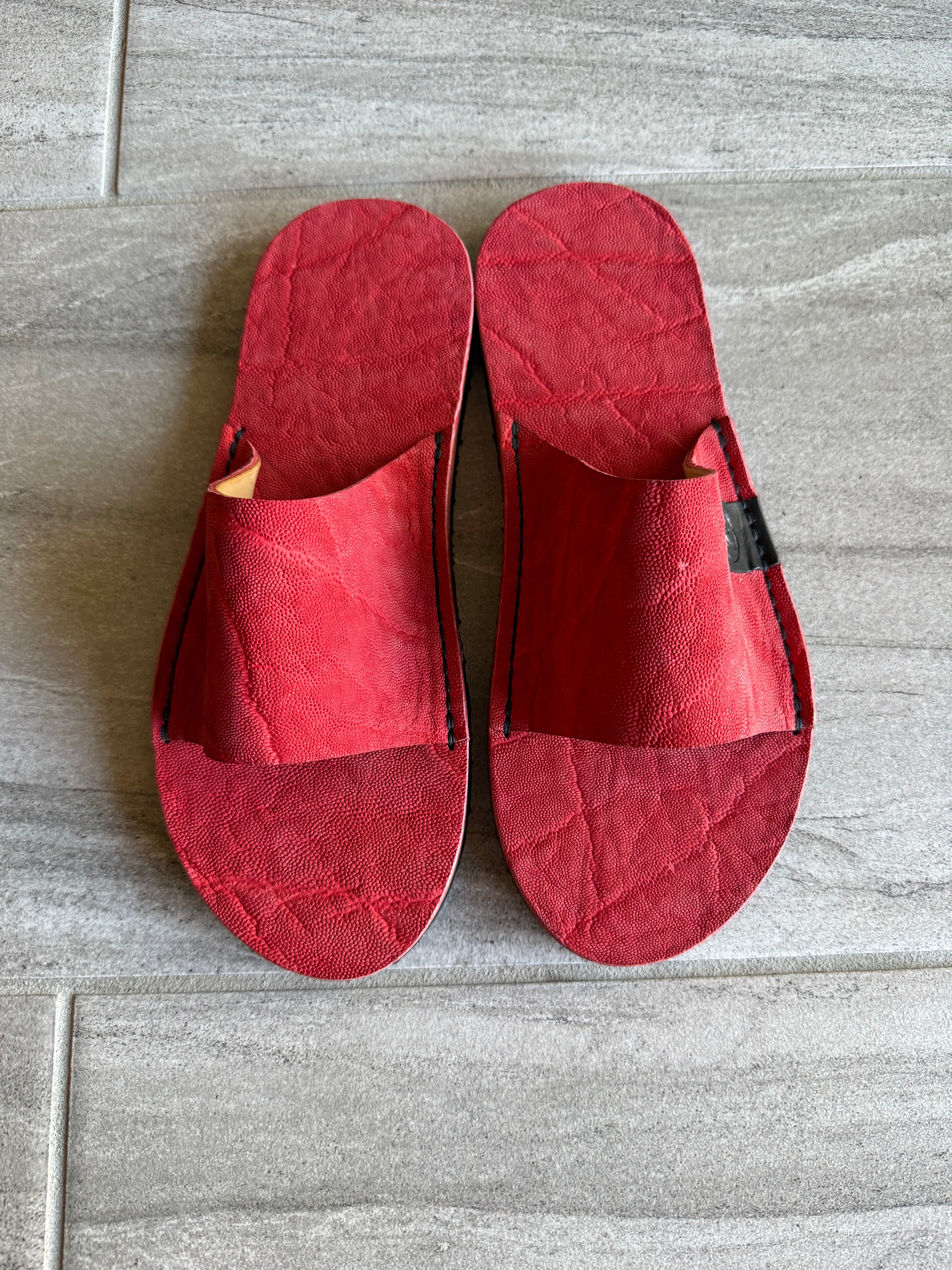 Red elephant slides by Toehold featuring a playful elephant design and comfortable slip-on style for casual wear.