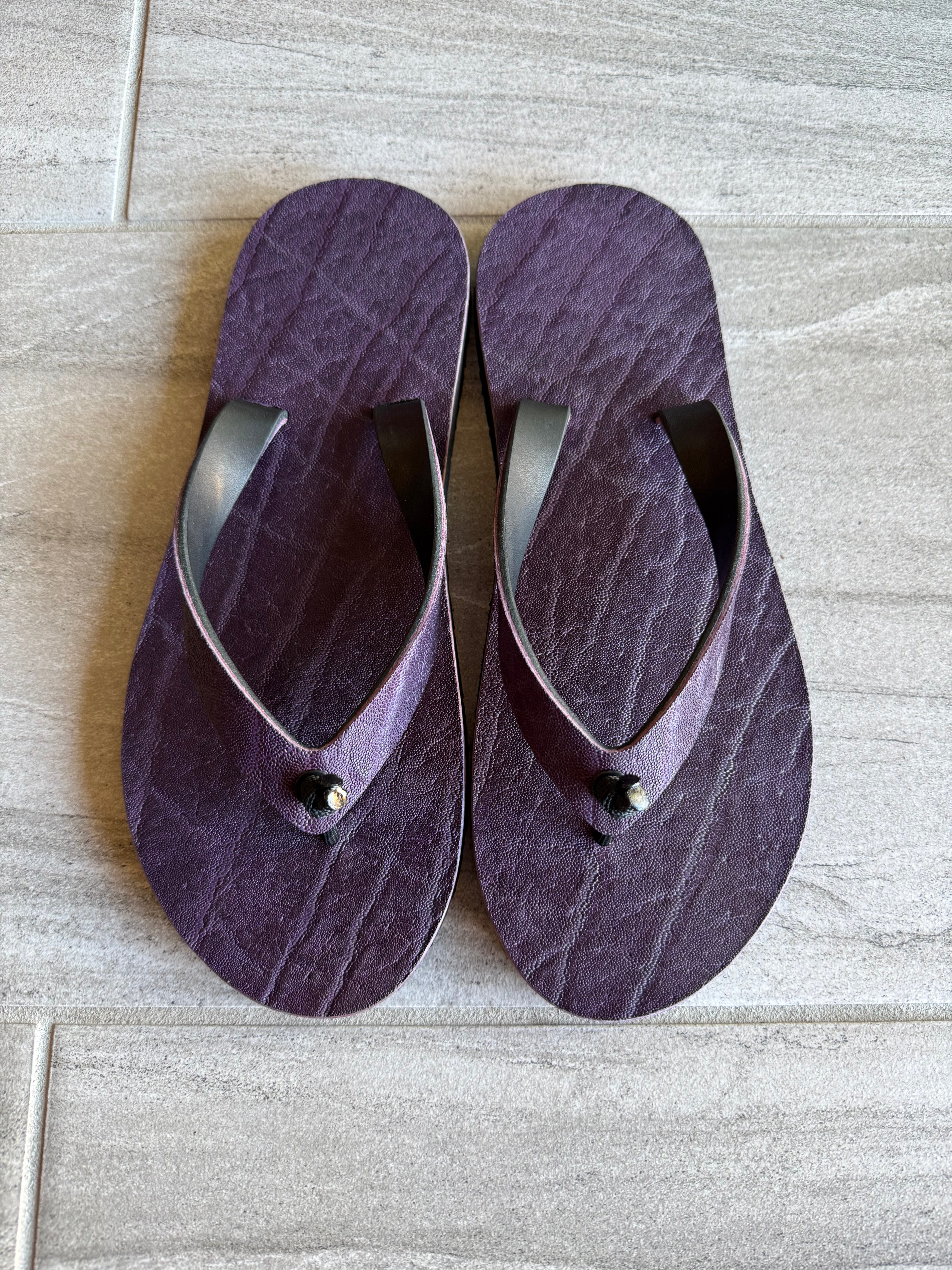 Purple Toehold elephant flip-flops featuring a playful elephant design on the straps and comfortable sole.