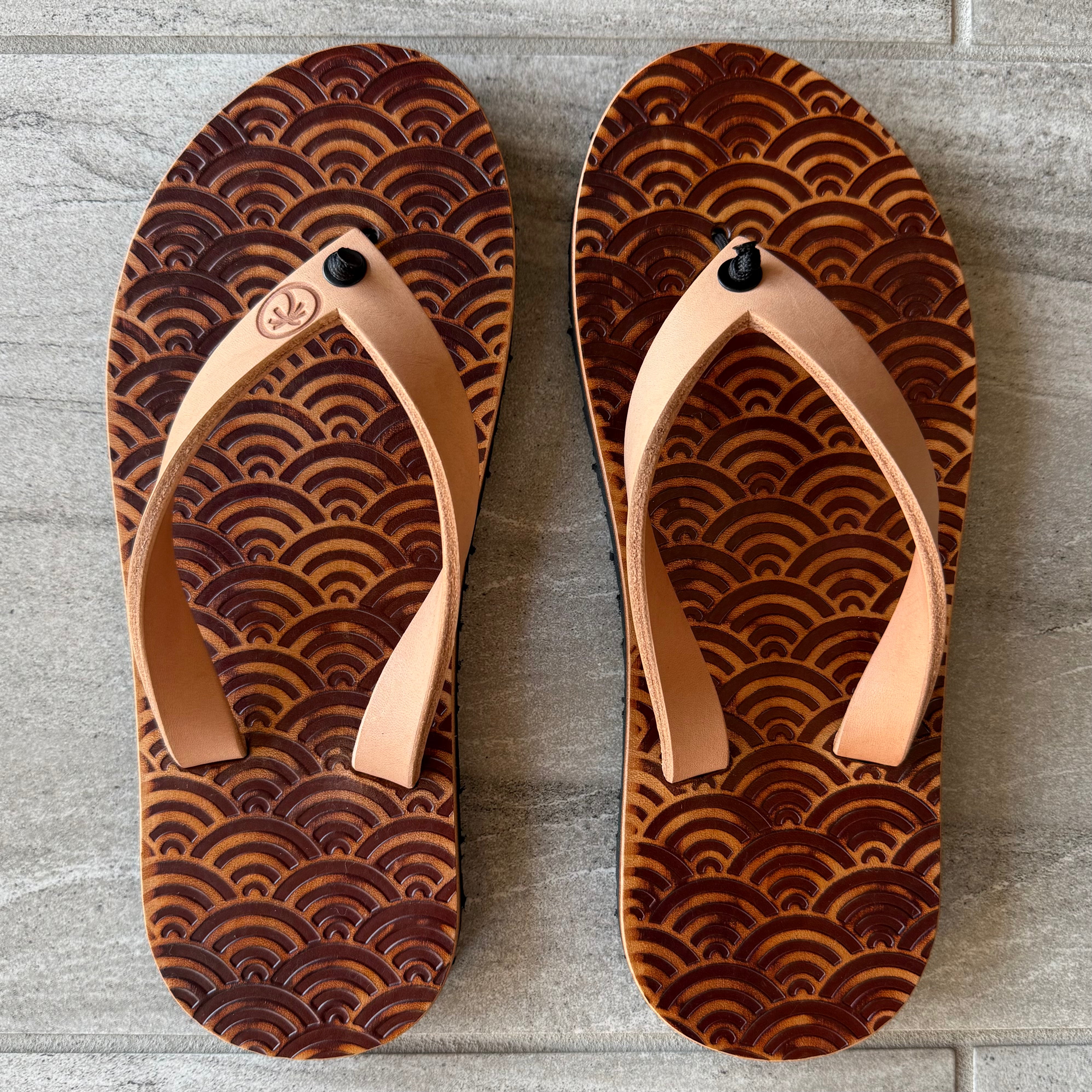 Toehold Samurai Armor flip-flops featuring a bold, armor-inspired design with straps and detailed patterns on the footbed.