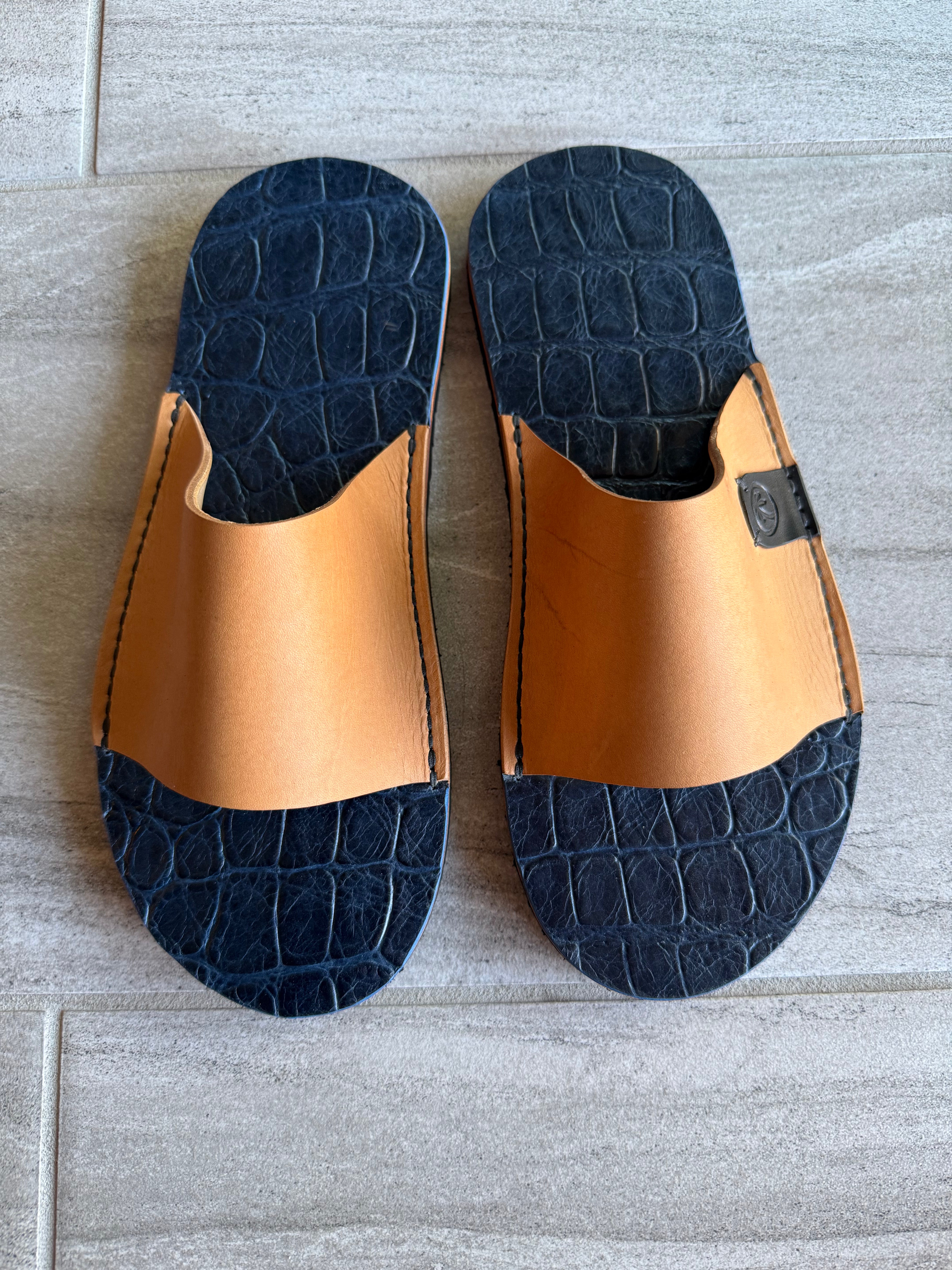 Saltwater crocodile slides by Toehold featuring crocodile skin texture and open-toe design, perfect for casual summer wear.