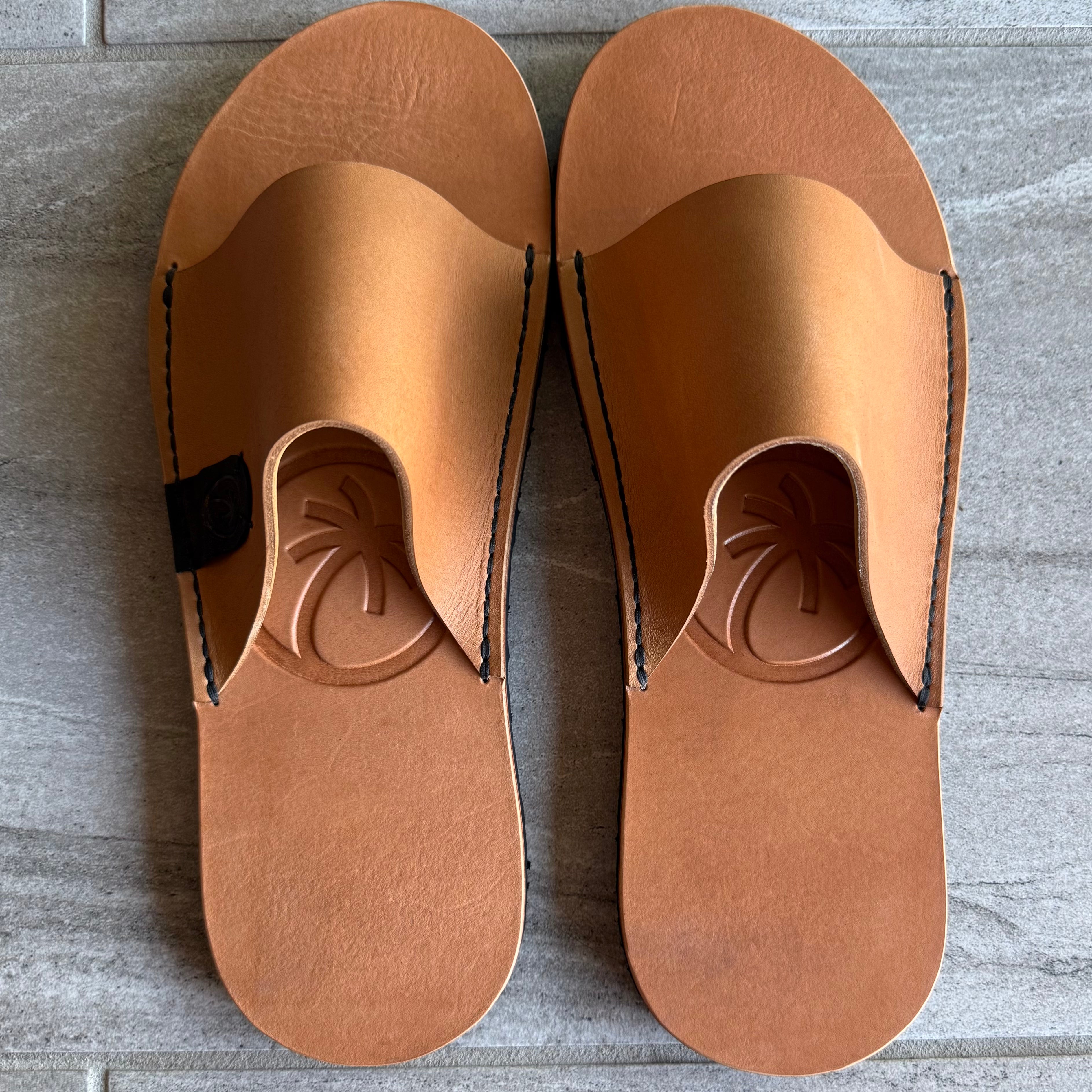 Toehold Classic Slides with cushioned straps and open-toe design, shown in neutral color on a clean background.