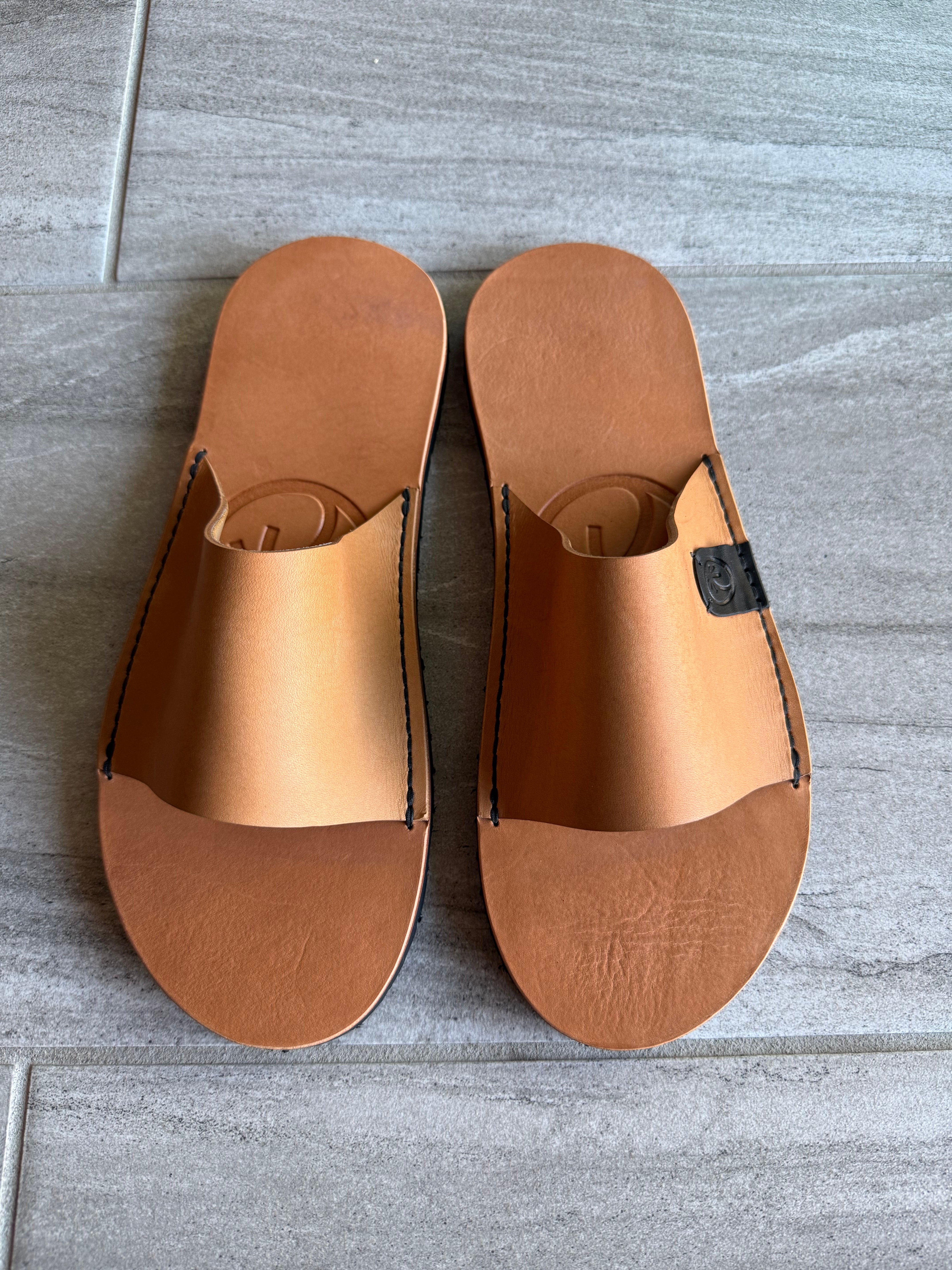 Toehold Classic Slides in neutral color, featuring a simple slip-on design and cushioned footbed for casual comfort.