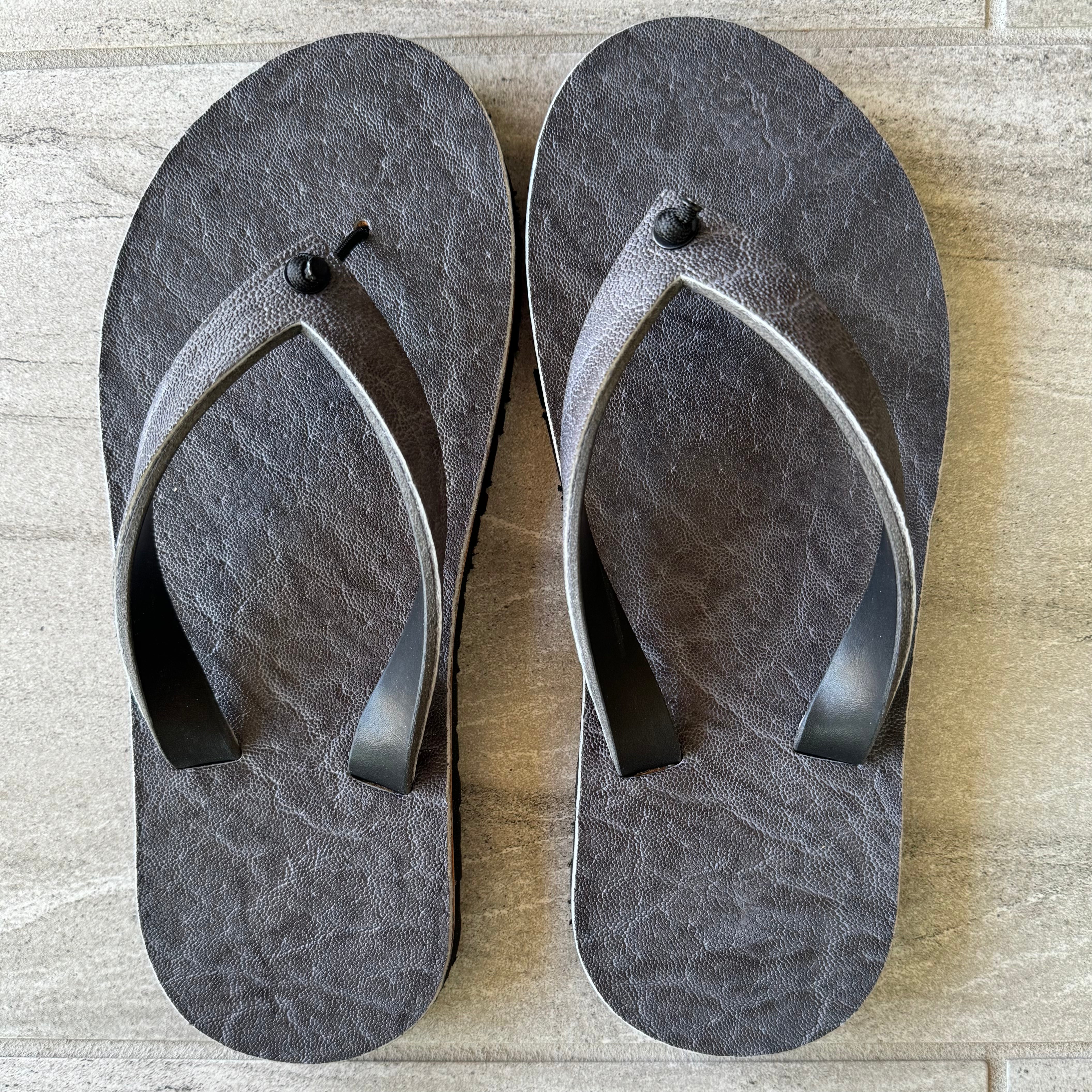 Grey African Elephant flip-flops by Toehold featuring elephant-shaped design and comfortable rubber soles.