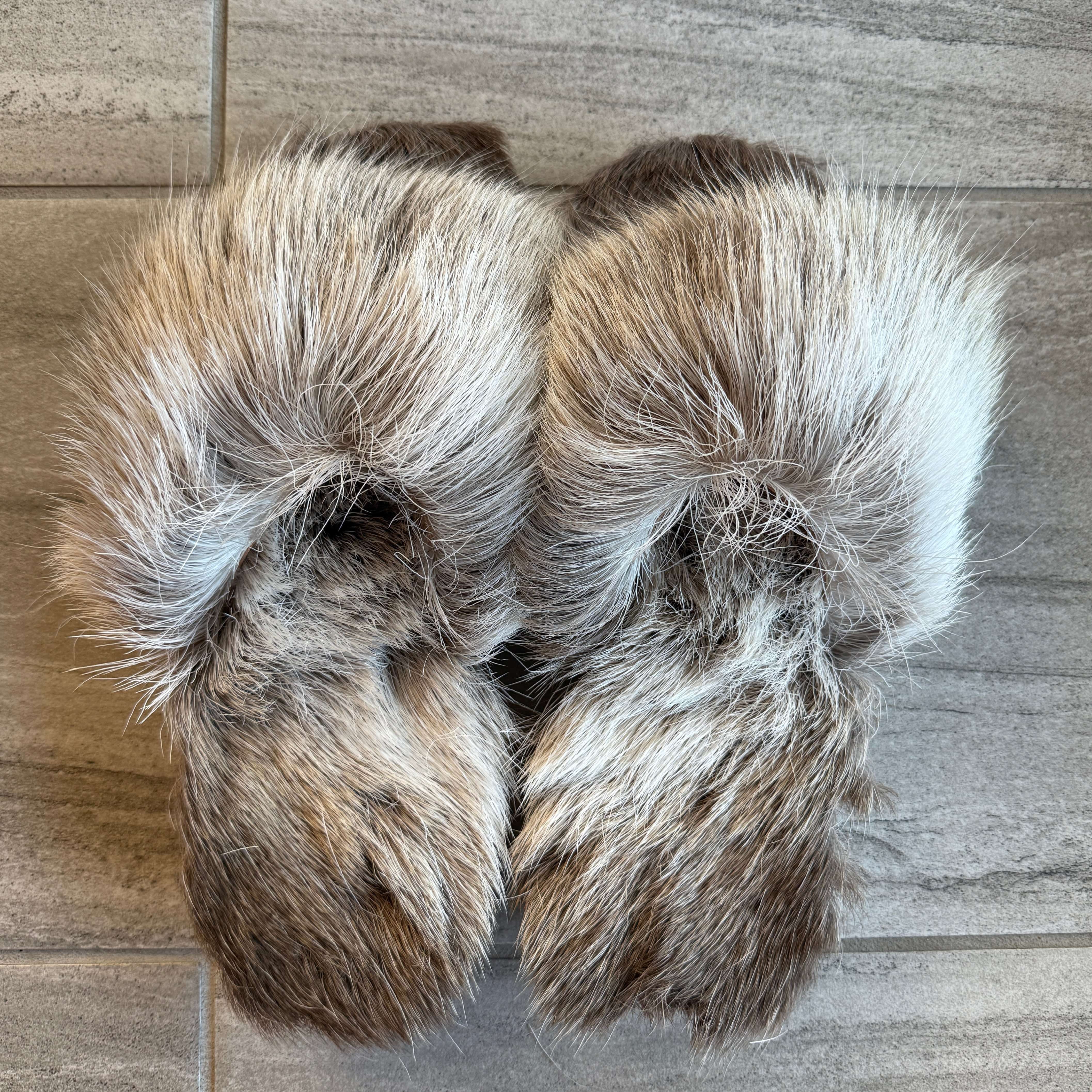 Toehold reindeer slippers featuring cozy knit fabric, with reindeer face design and antler details for festive comfort.