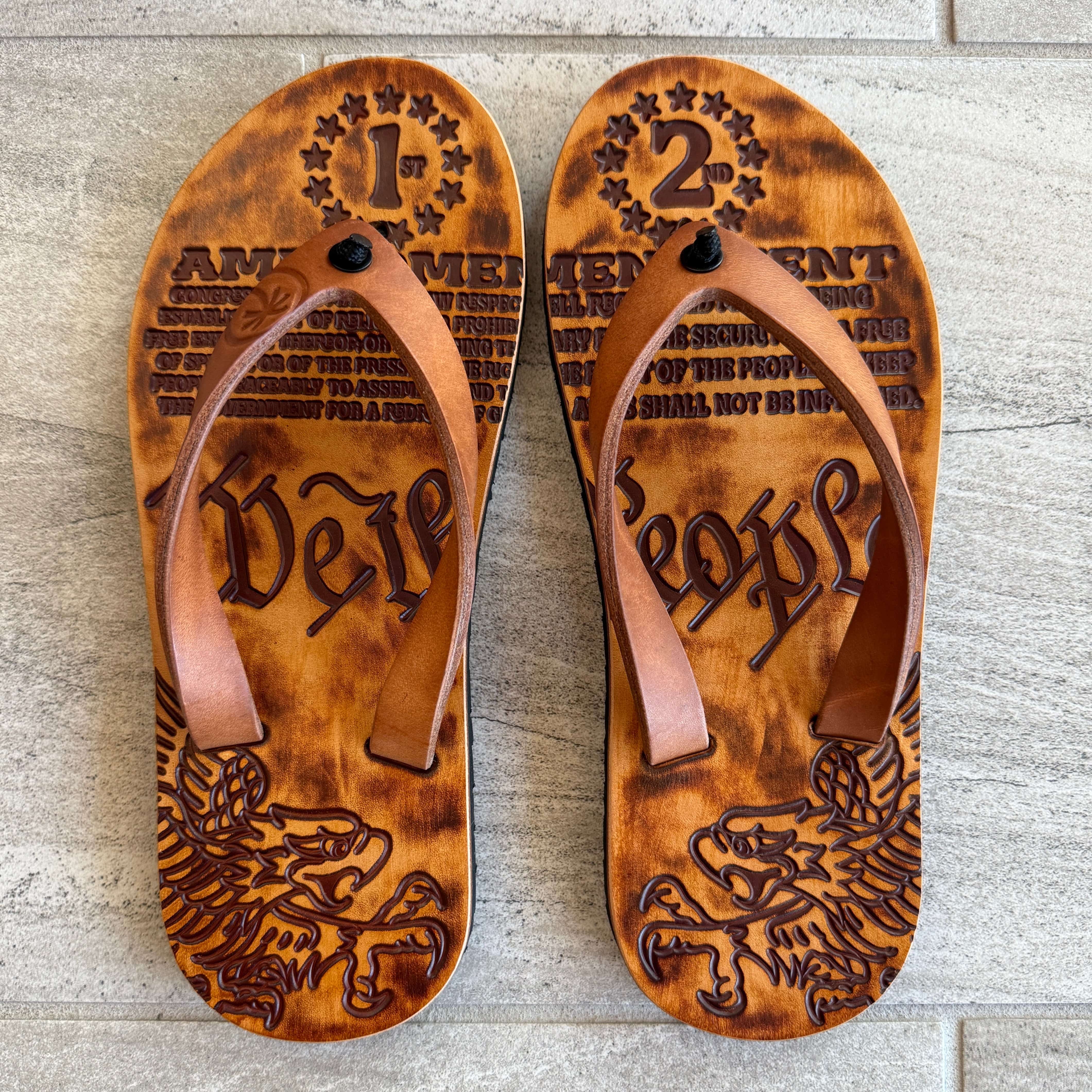 Toehold Patriot flip-flops with black straps and colorful sole, casual footwear for summer comfort.