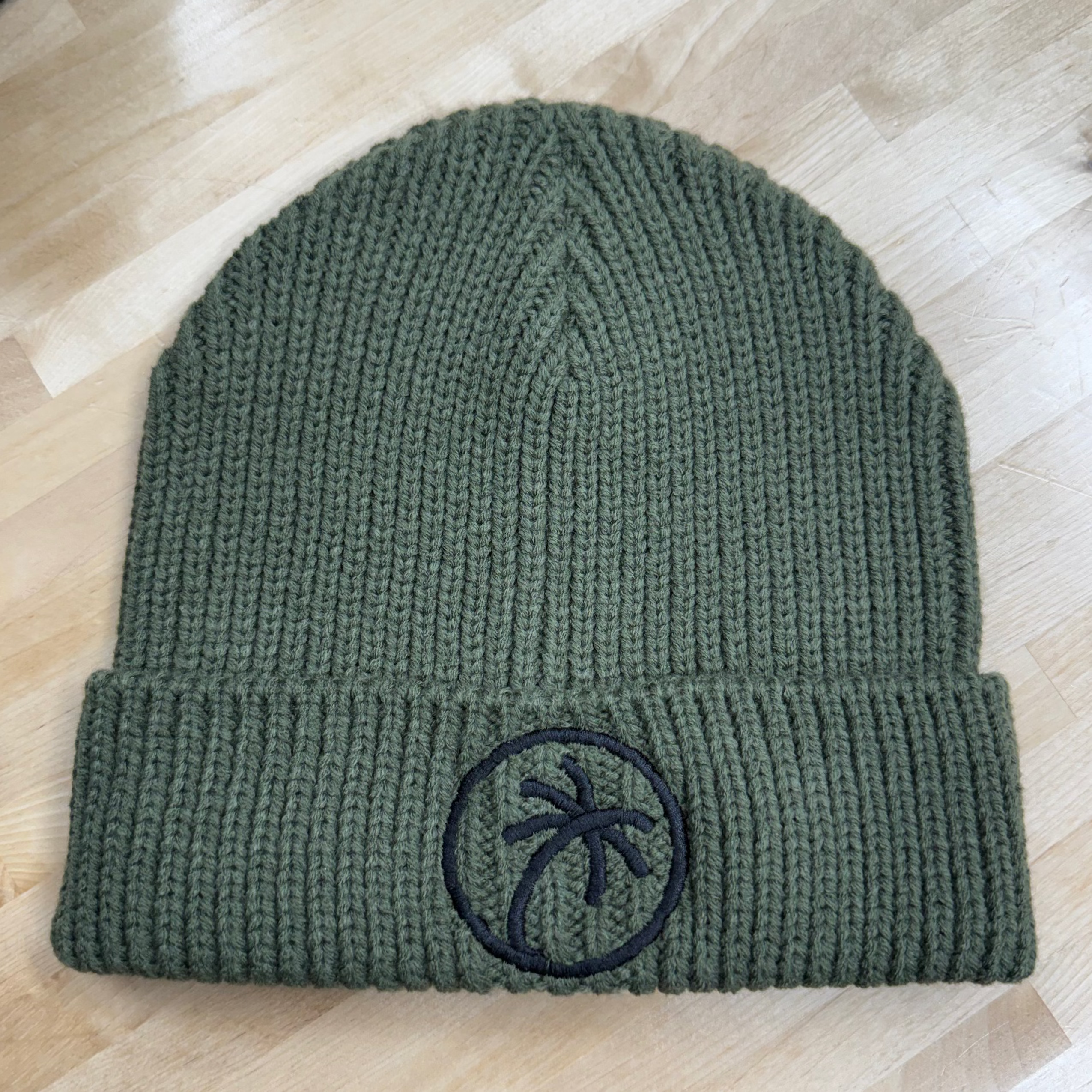 Toehold Beanie in soft knit fabric, shown in a close-up image, featuring a snug fit and classic design for warmth and style