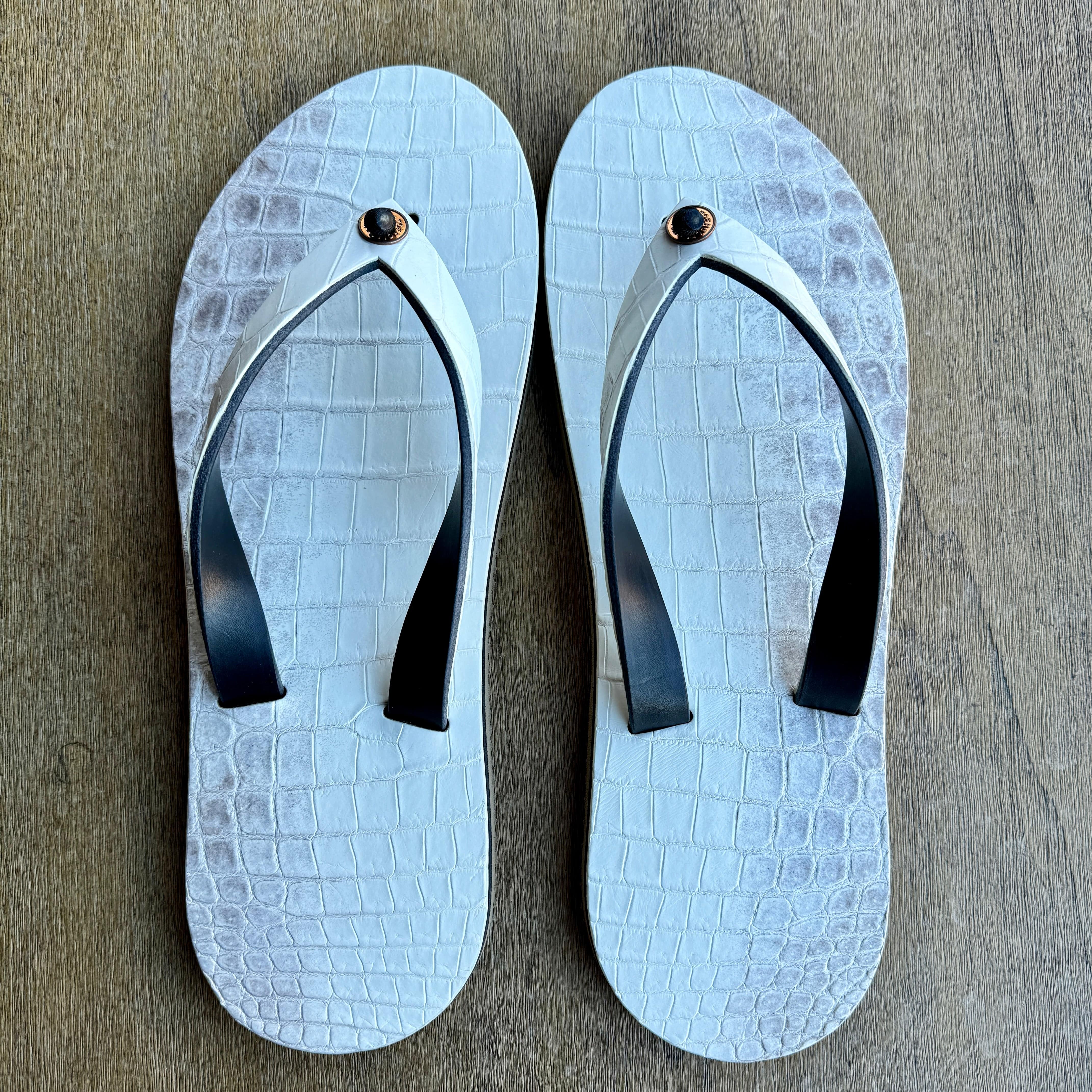 Toehold Himalayan Crocodile flip-flops with textured crocodile pattern in brown and beige tones.