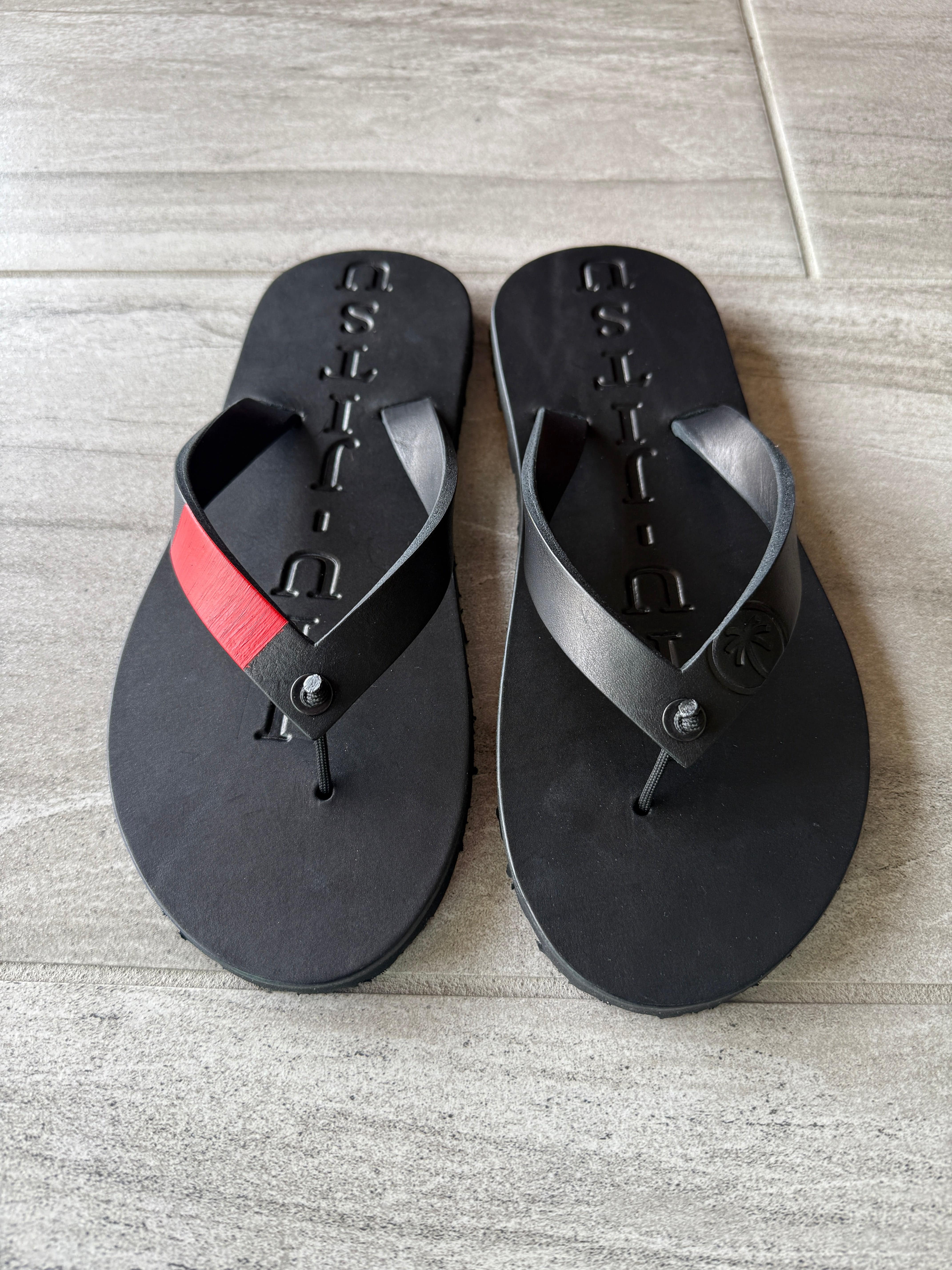 BlackToehold Flip-Flops featuring black straps and cushioned soles, casual footwear perfect for everyday wear.