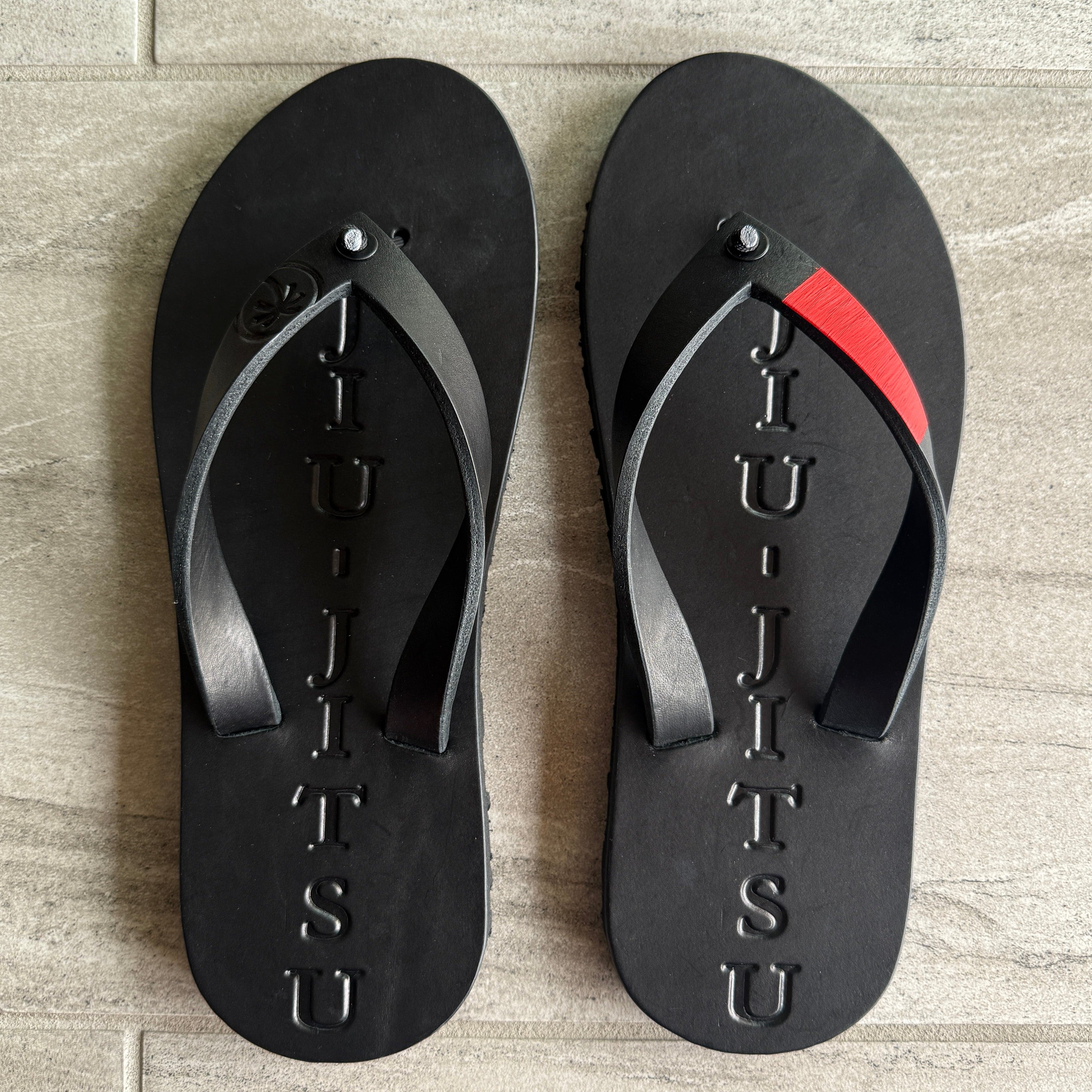 Toehold BlackBelt flip-flops with black straps and textured soles, casual footwear for everyday wear.