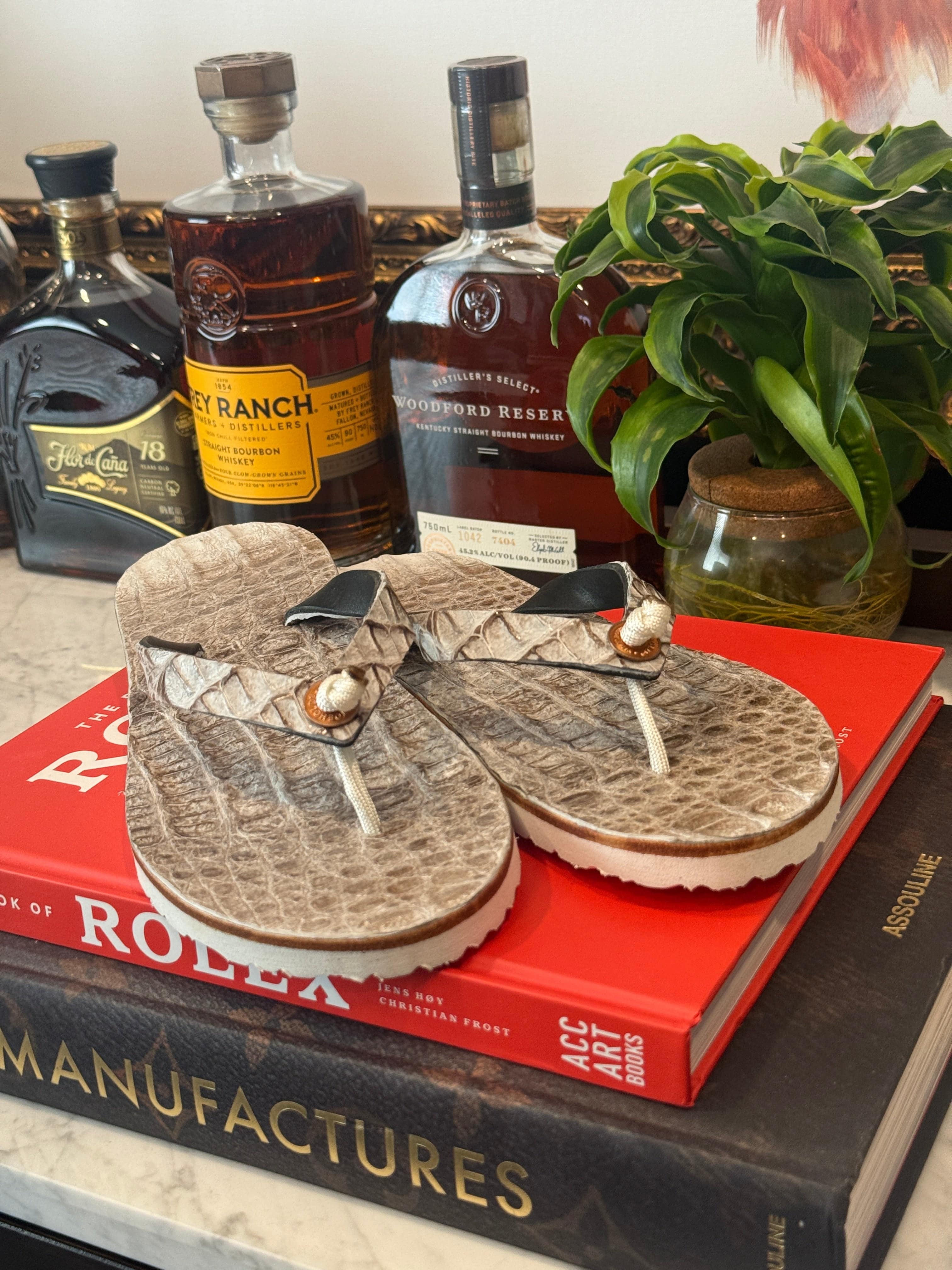 Toehold Himalayan Crocodile flip-flops featuring a textured crocodile pattern and casual slip-on design.