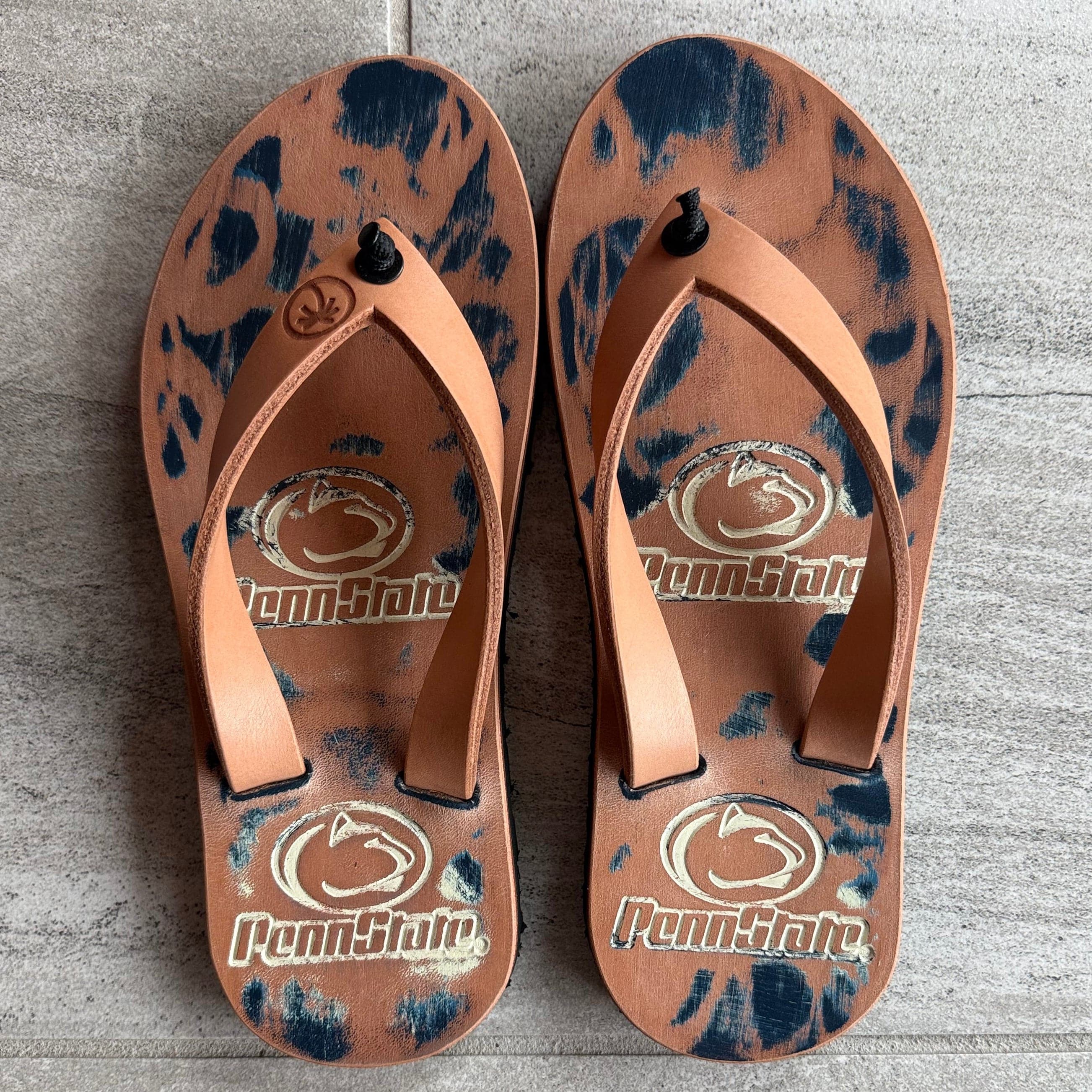 Toehold women's 9 Penn State RTS flip-flops with navy straps and white soles, featuring the Penn State logo on the straps.
