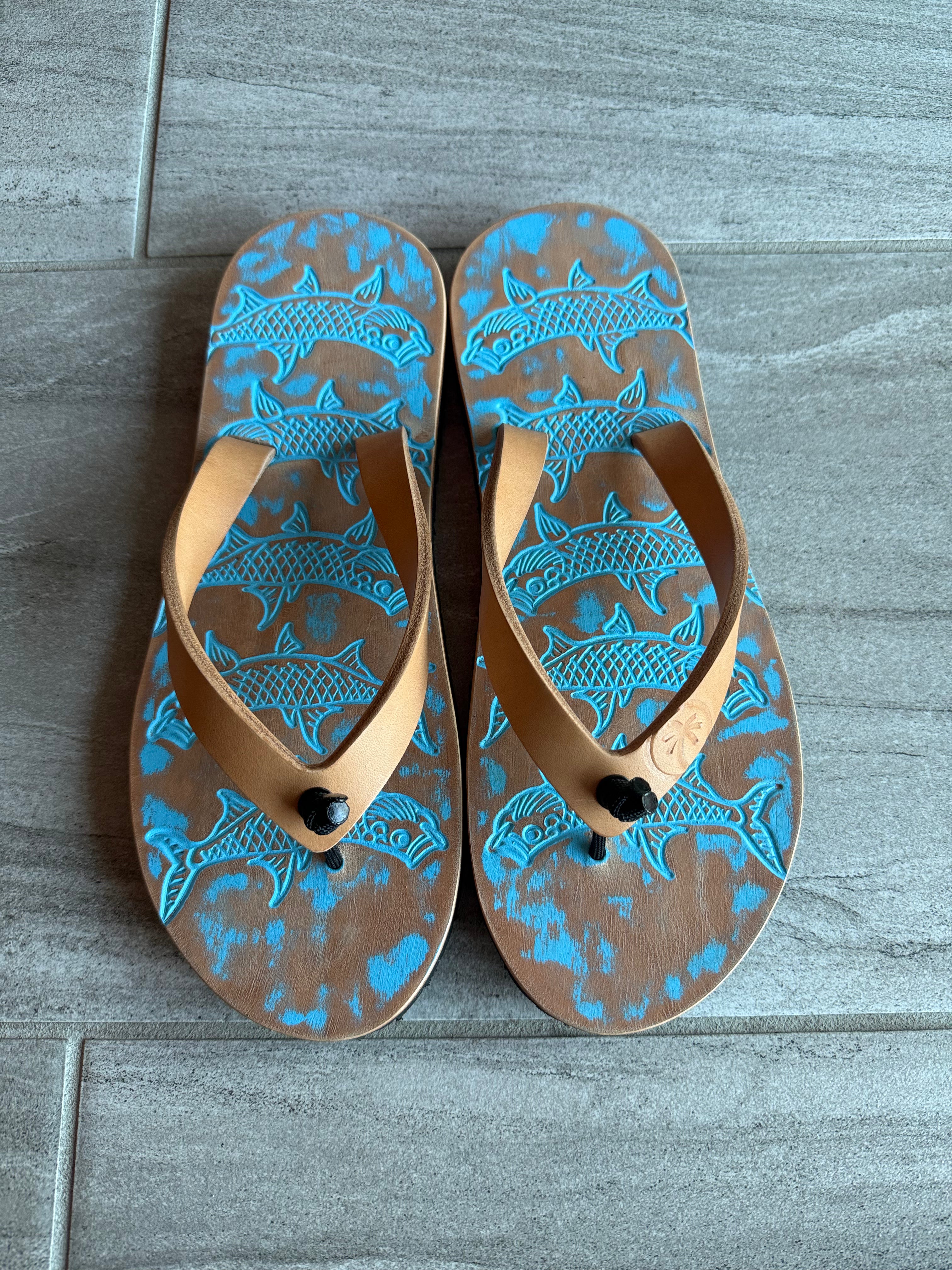 Pale blue Toehold Tarpon flip-flops with cushioned straps and rubber soles, perfect for casual summer wear.