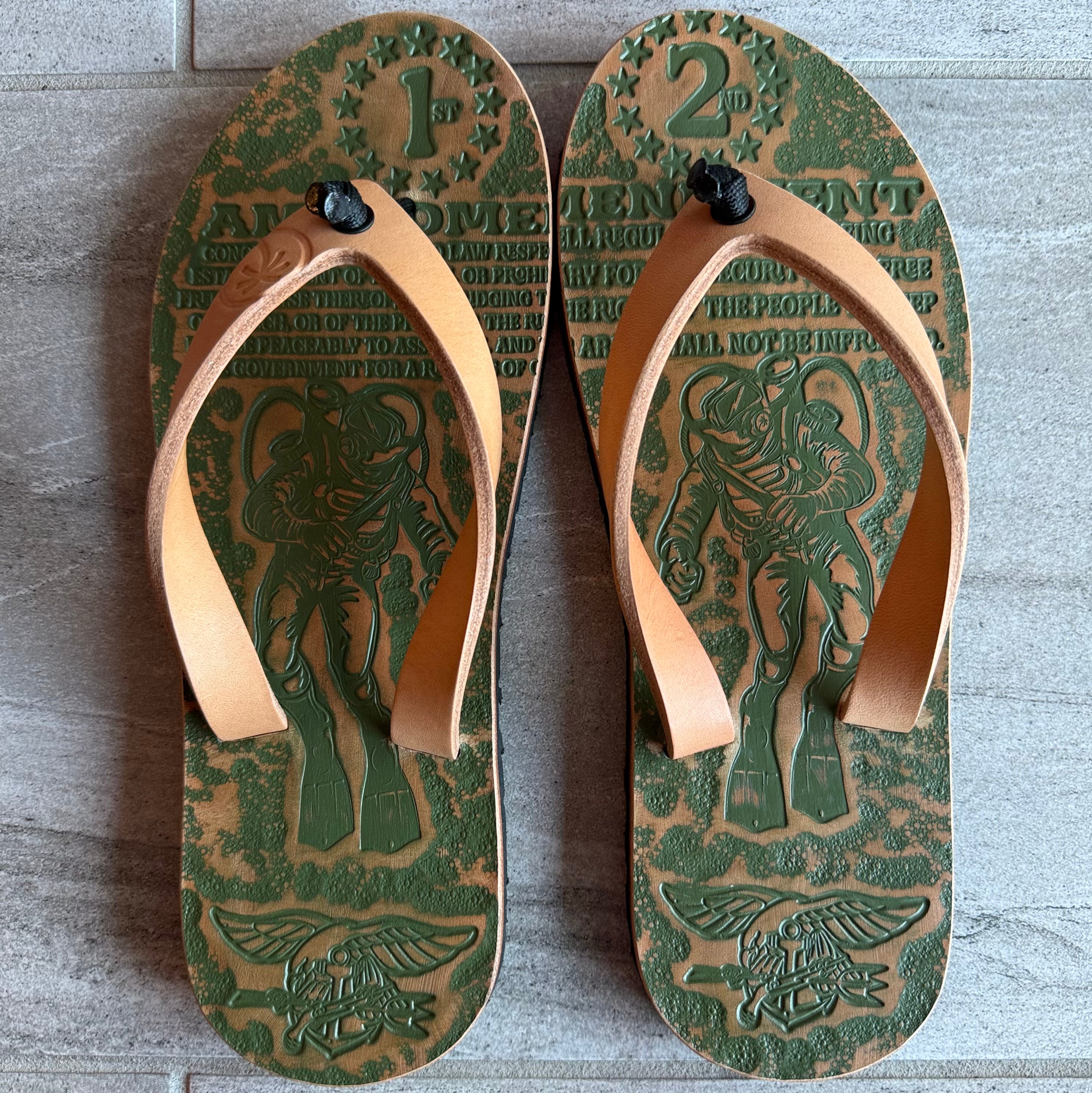 Toehold navy blue flip-flops with adjustable straps and cushioned soles, perfect for casual wear and summer comfort.