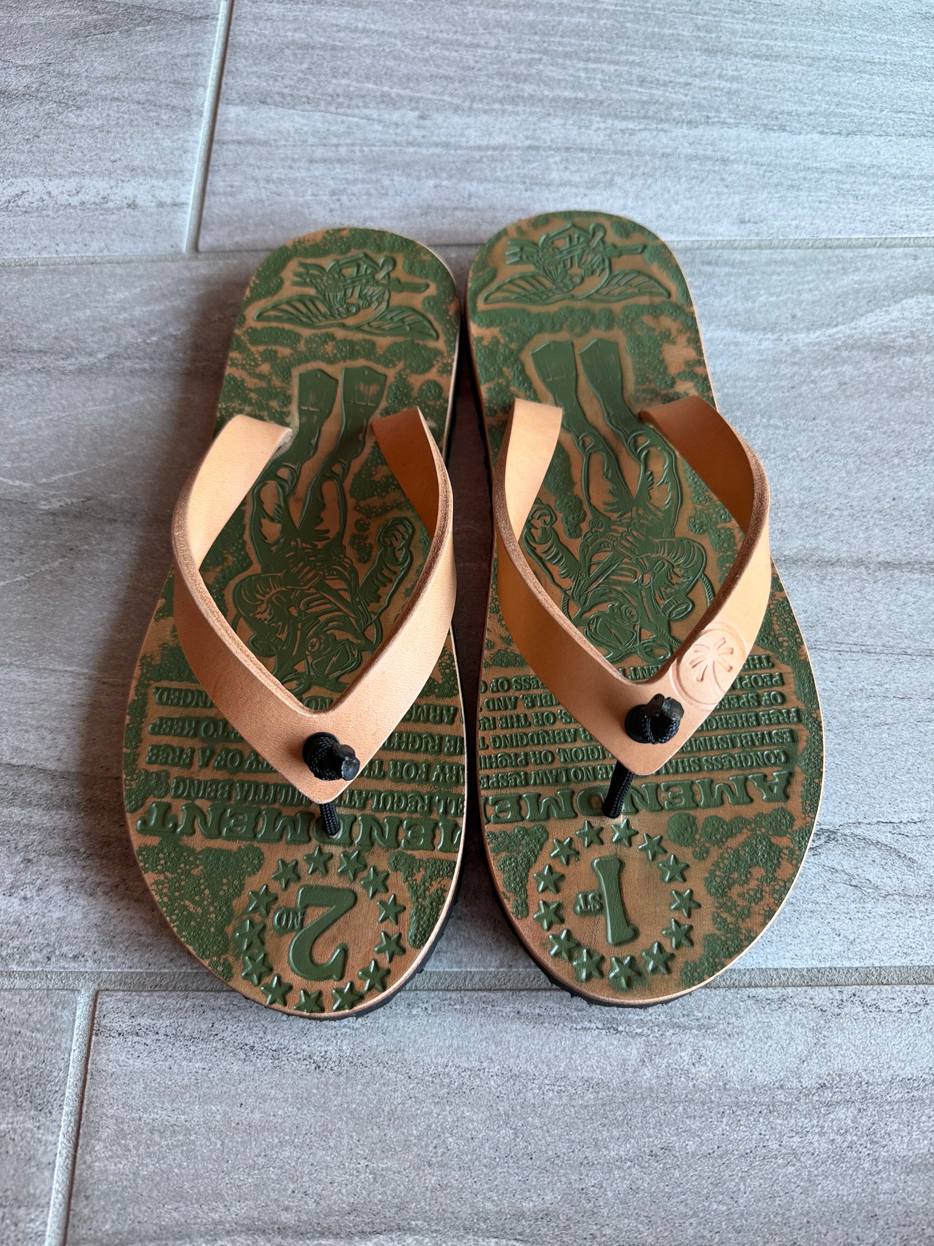 Navy SEAL Toehold flip-flops with navy straps and cushioned soles, designed for comfort and casual wear.