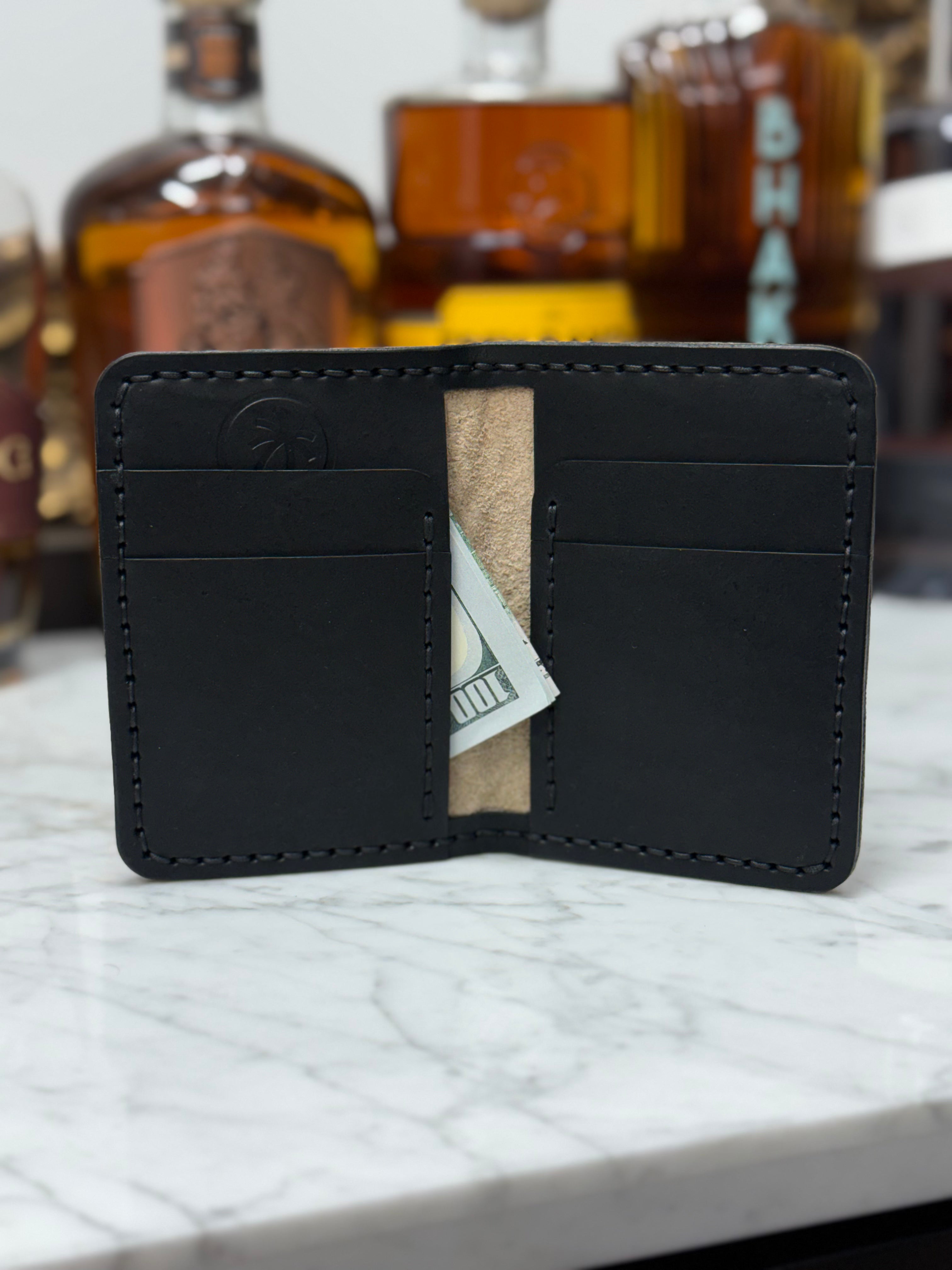 Toehold Man Killing Elephant JW Wallet showing detailed leather design and craftsmanship.