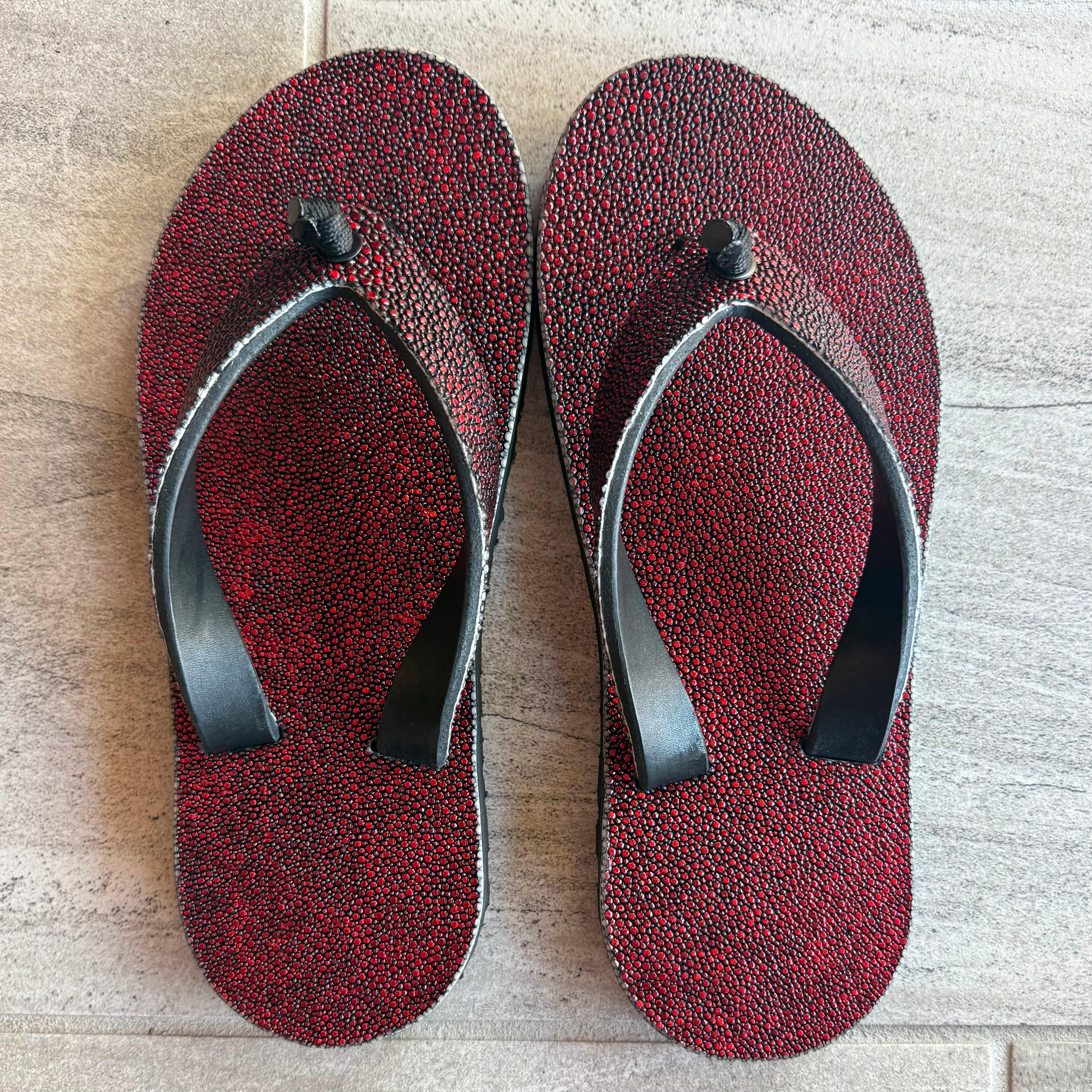 Toehold Vampire Stingray flip-flops with black straps and textured soles, showcasing their comfortable casual footwear design.