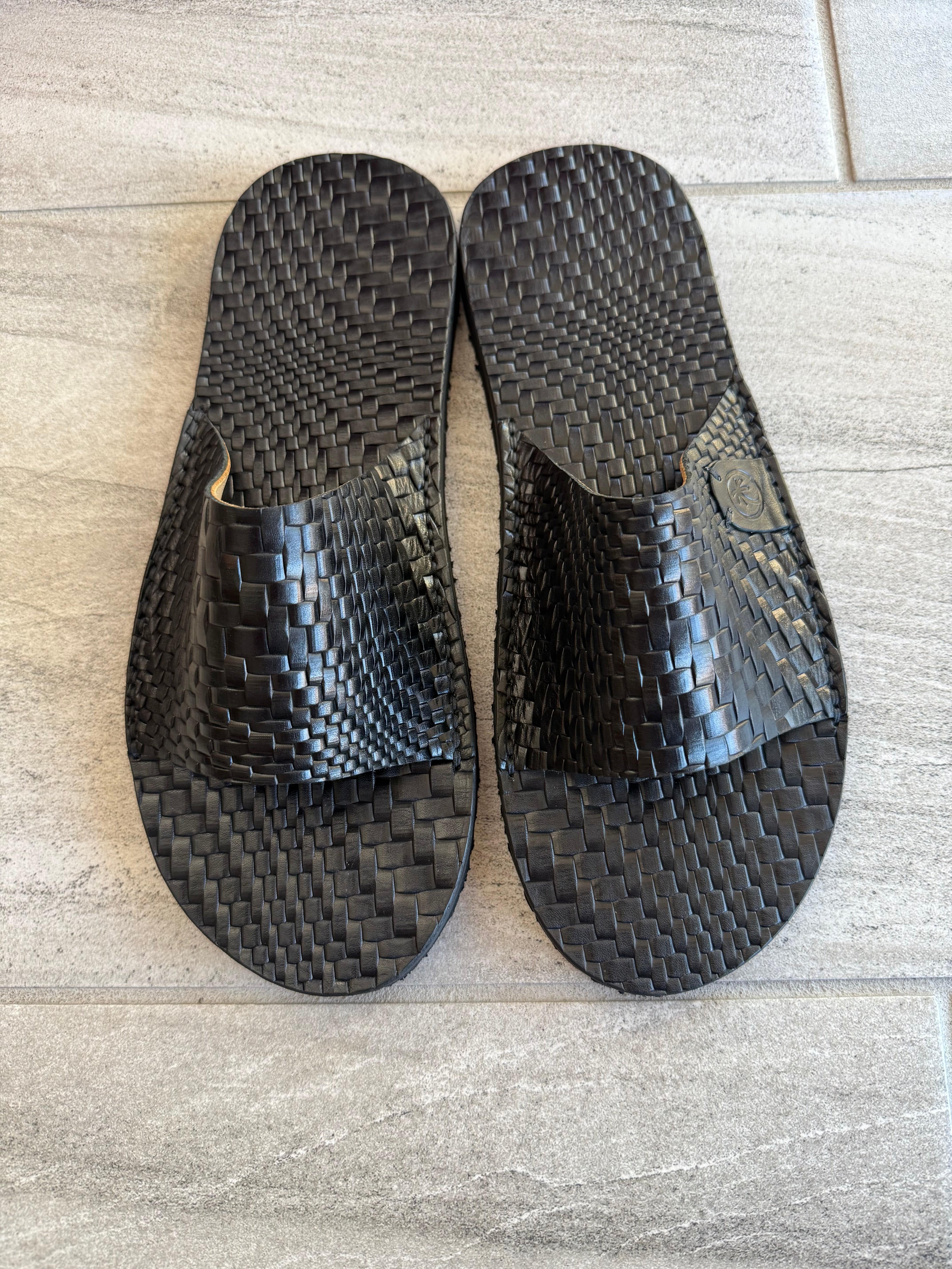 Black Grenade Slides flip-flops by Toehold featuring a bold grenade design on comfortable rubber soles.
