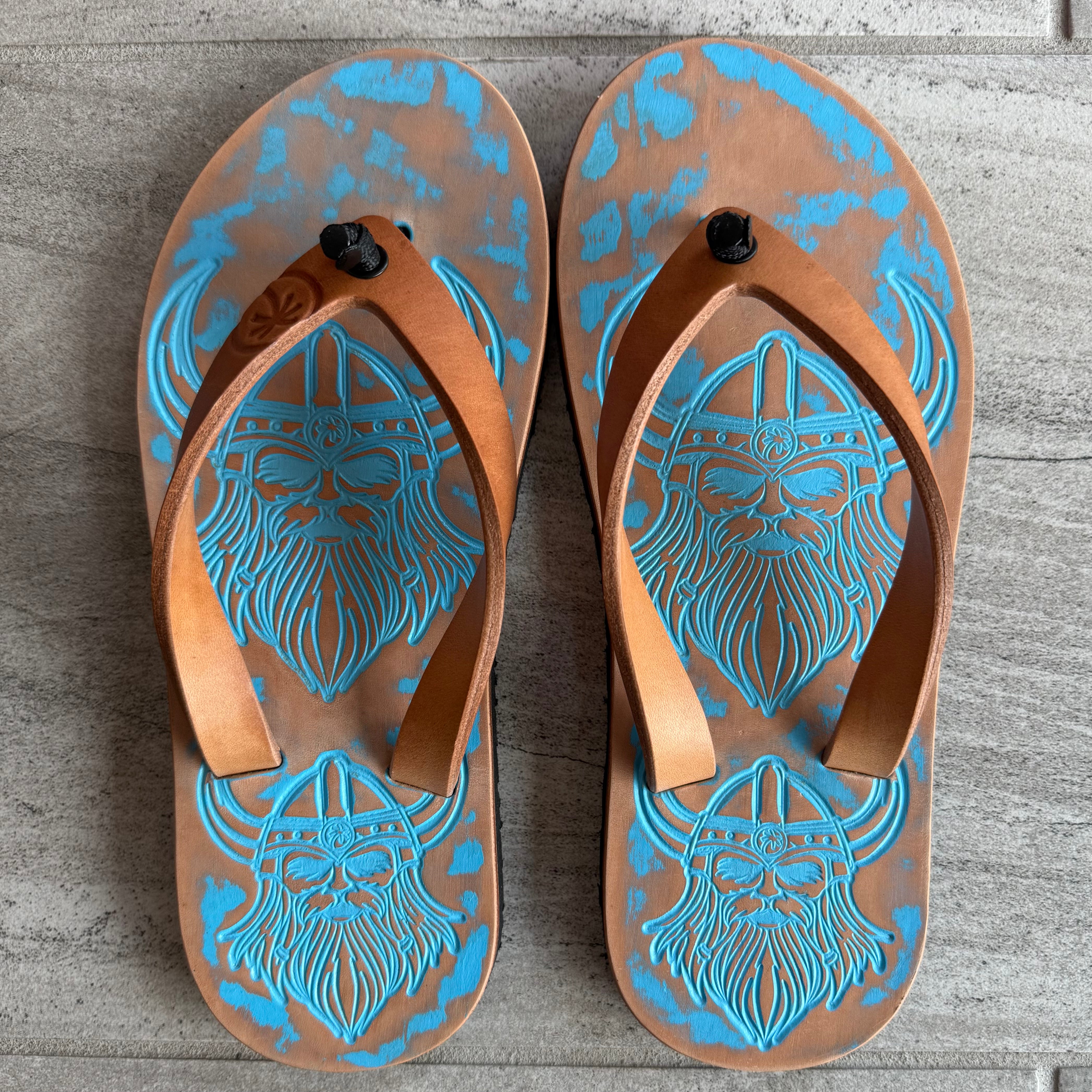 Toehold Viking flip-flops with black straps and cushioned footbed, shown on a white background.