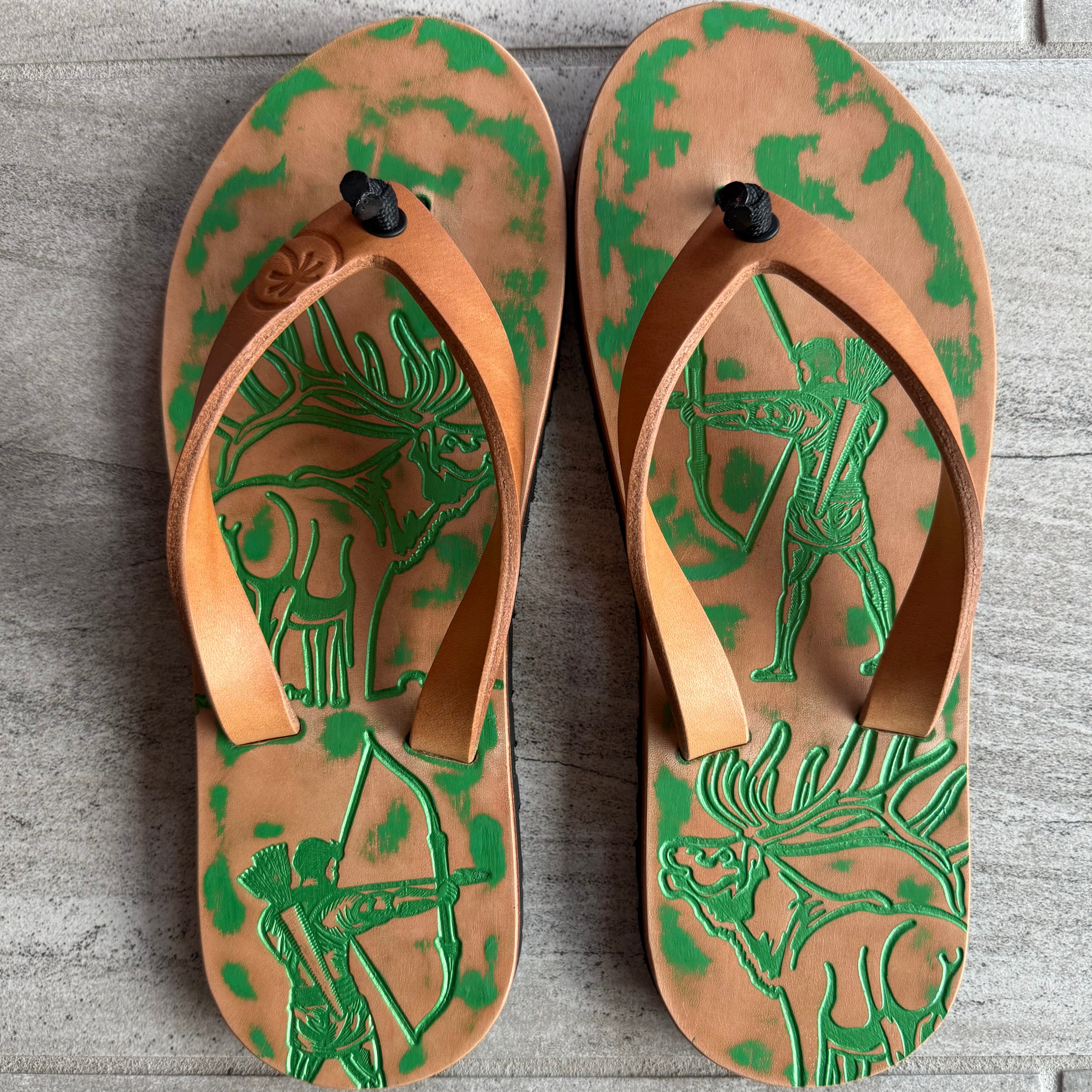 Emerald Bow Hunter flip-flops by Toehold with green straps and bow detail, featuring a comfortable rubber sole and stylish design.