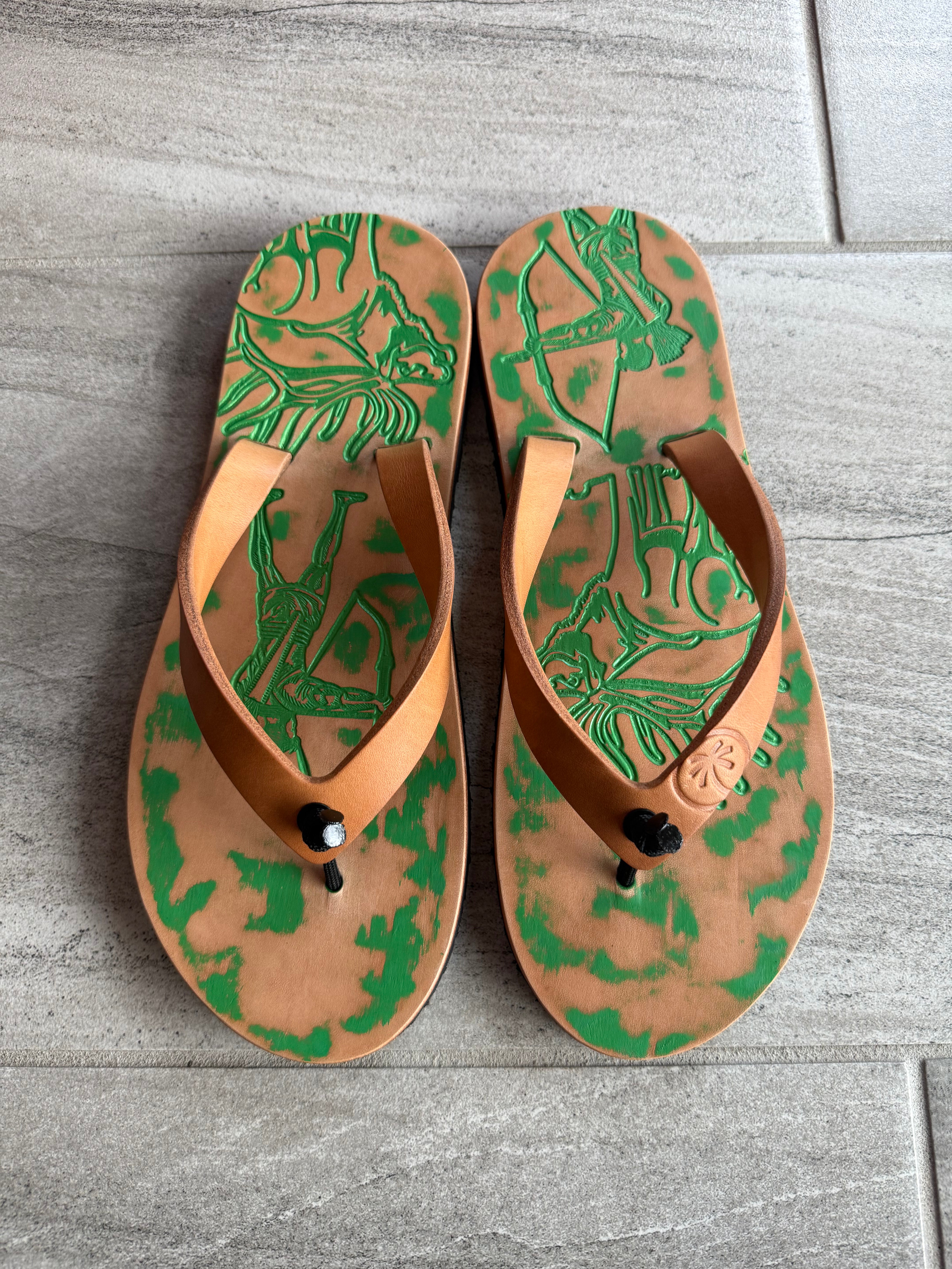 Toehold Emerald Bow Hunter flip-flops featuring green straps and bow design, displayed on a clean white background.