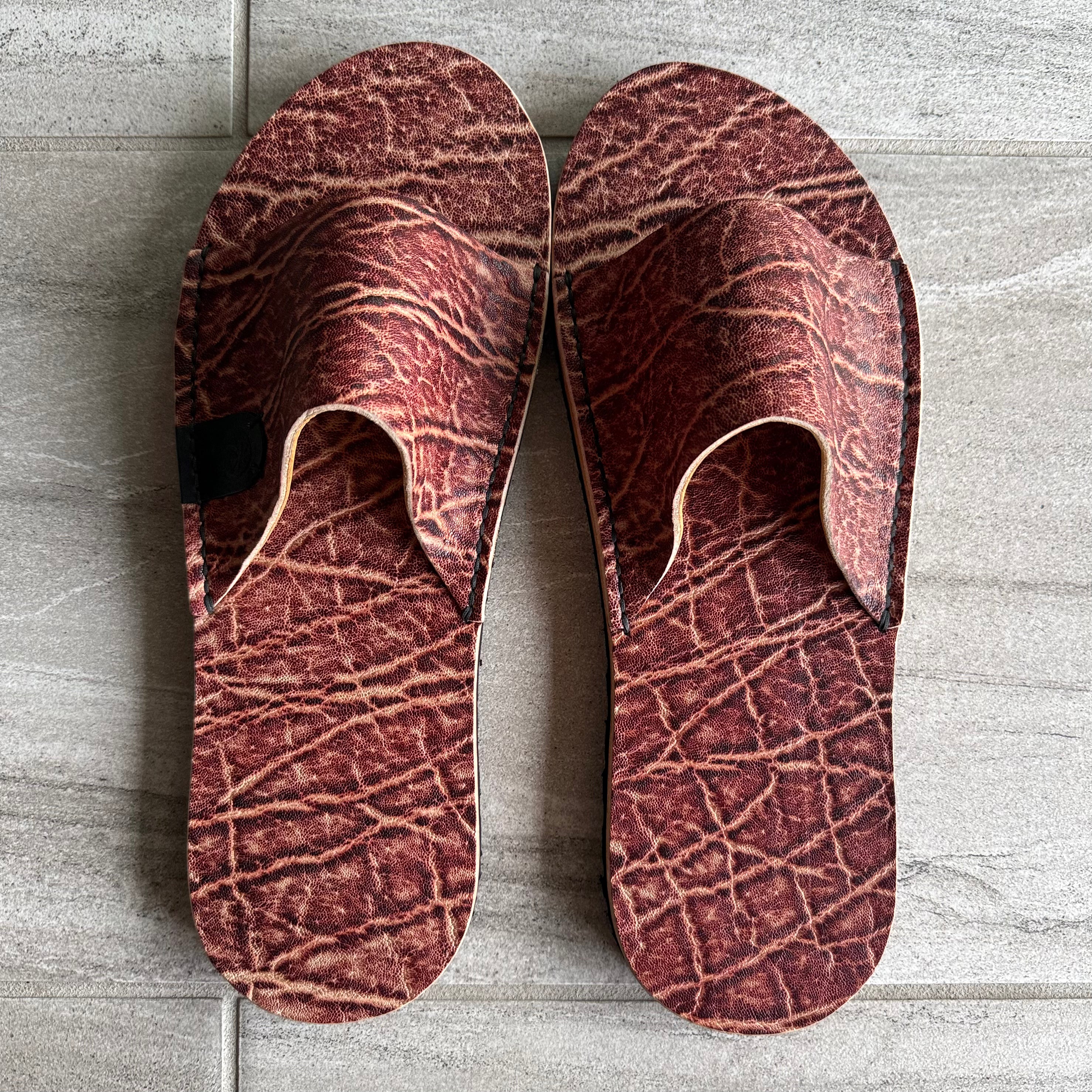 Toehold Man Killer Elephant Slides featuring large elephant-shaped design and comfortable slip-on style.