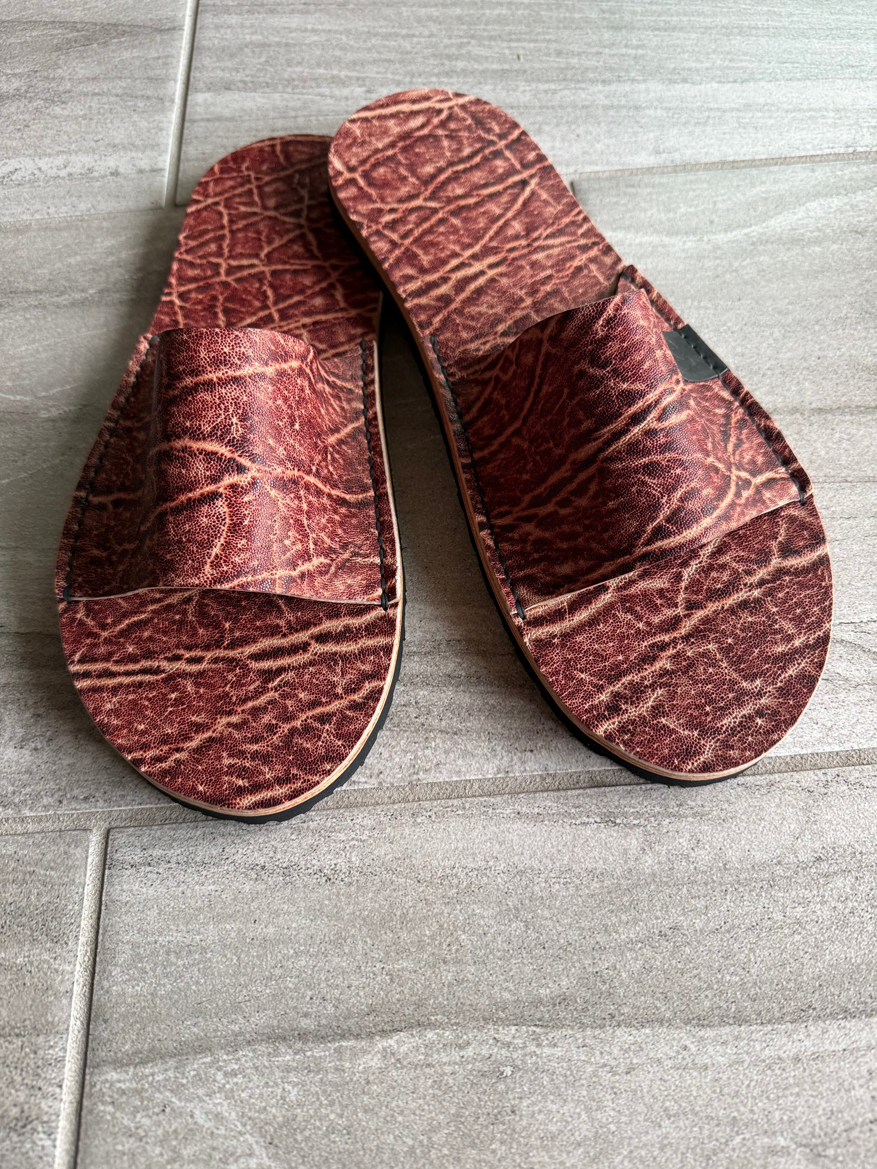 Toehold Man Killer Elephant Slides featuring bold elephant design and comfortable slip-on style, perfect for casual wear.