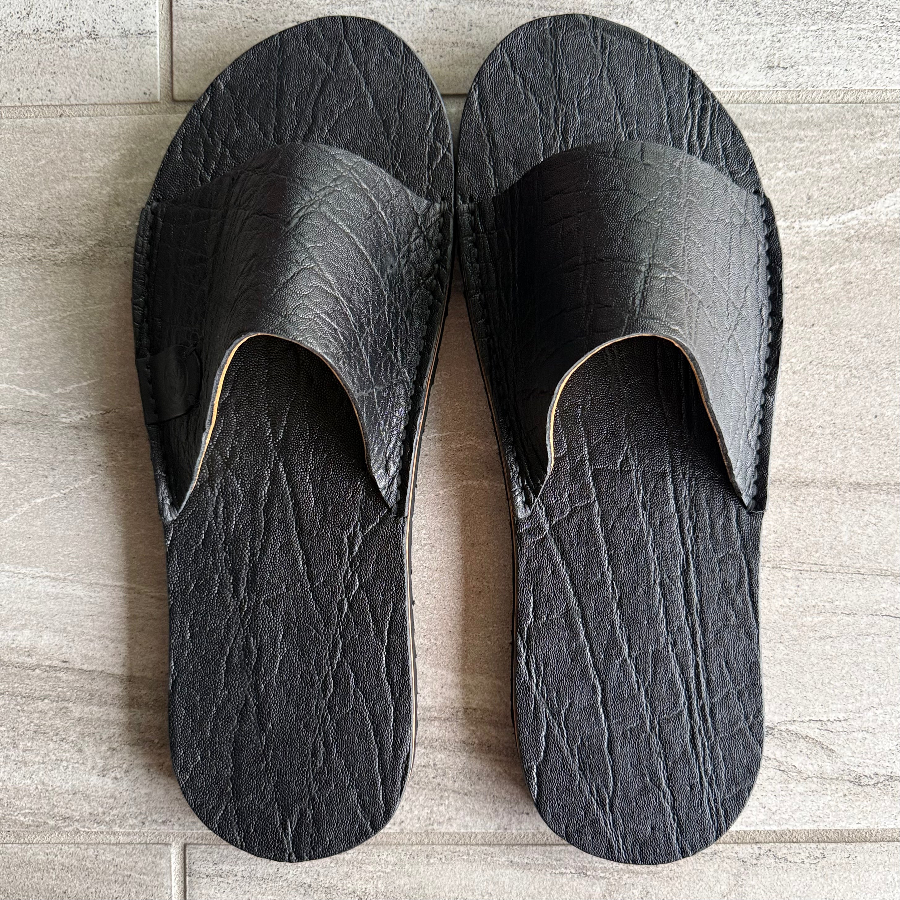 Black African Elephant slides by Toehold, featuring detailed elephant print on comfortable slip-on footwear.
