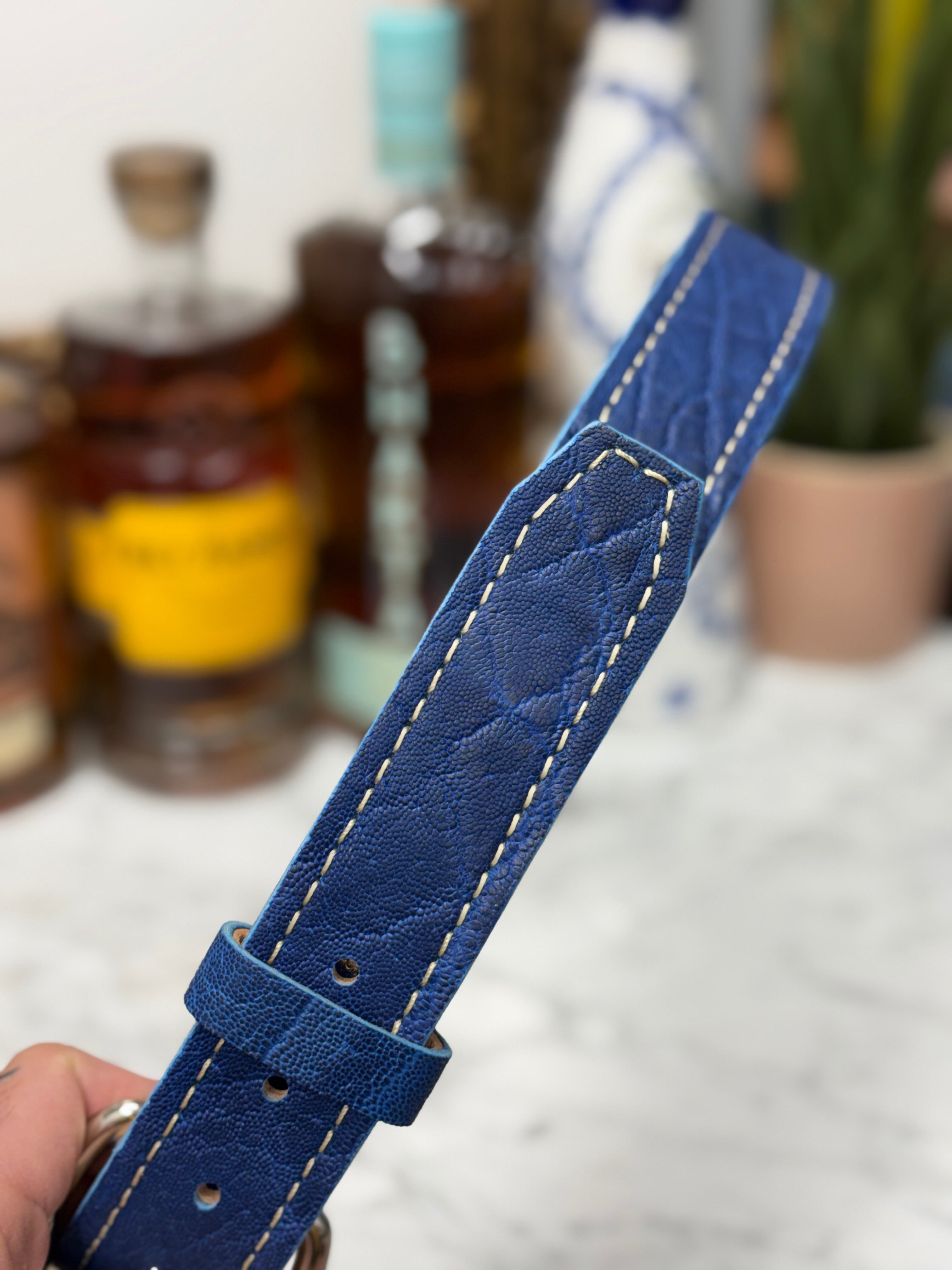 Blue Elephant Belts by Toehold featuring a vibrant blue strap with elephant-themed design and sturdy buckle.