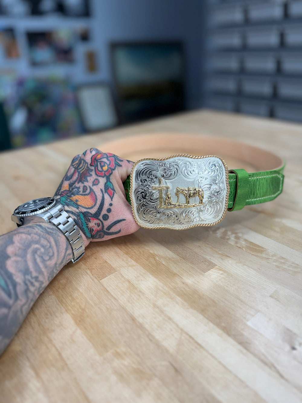 Emerald green cowhide belt from Toehold featuring a polished metal buckle and textured leather finish.