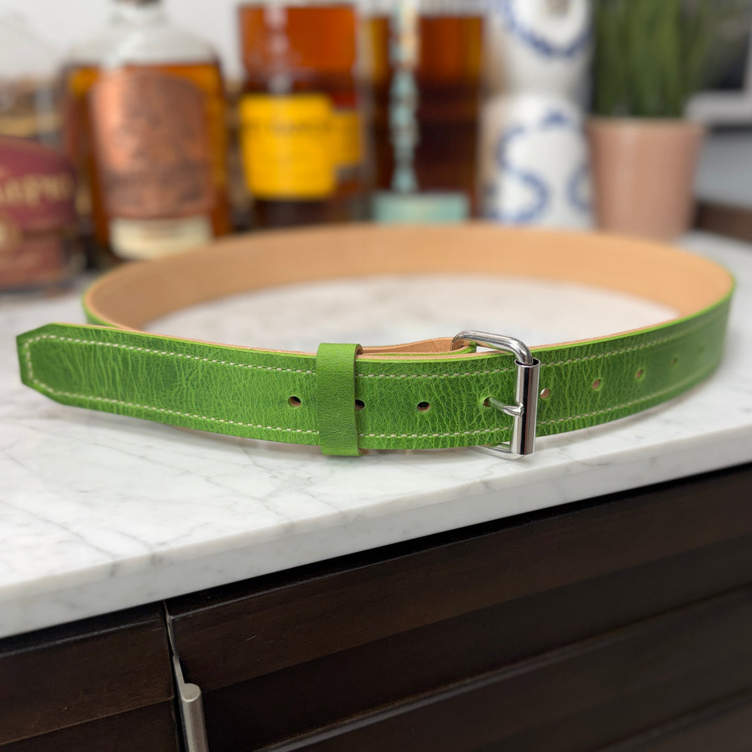 Emerald green cowhide belt from Toehold featuring a sleek buckle and textured leather finish.