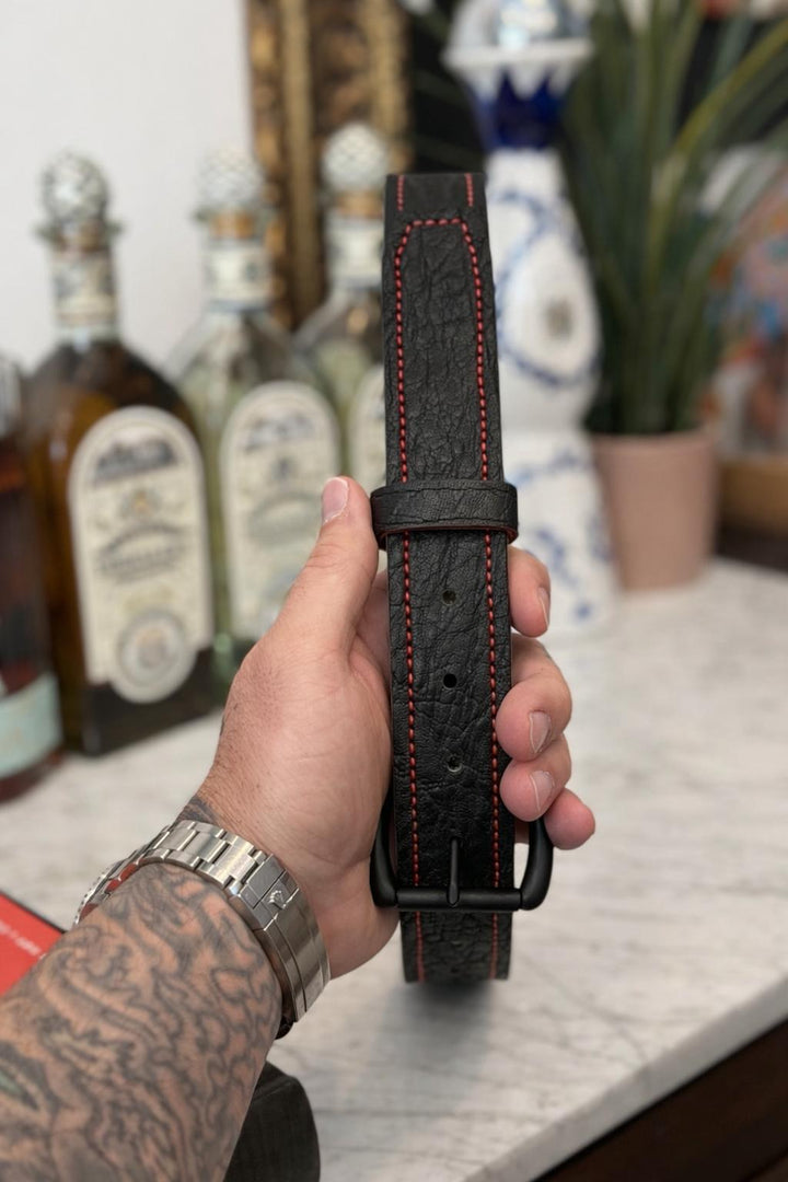 Black elephant belt by Toehold featuring a detailed elephant design, made of durable material with a classic buckle.