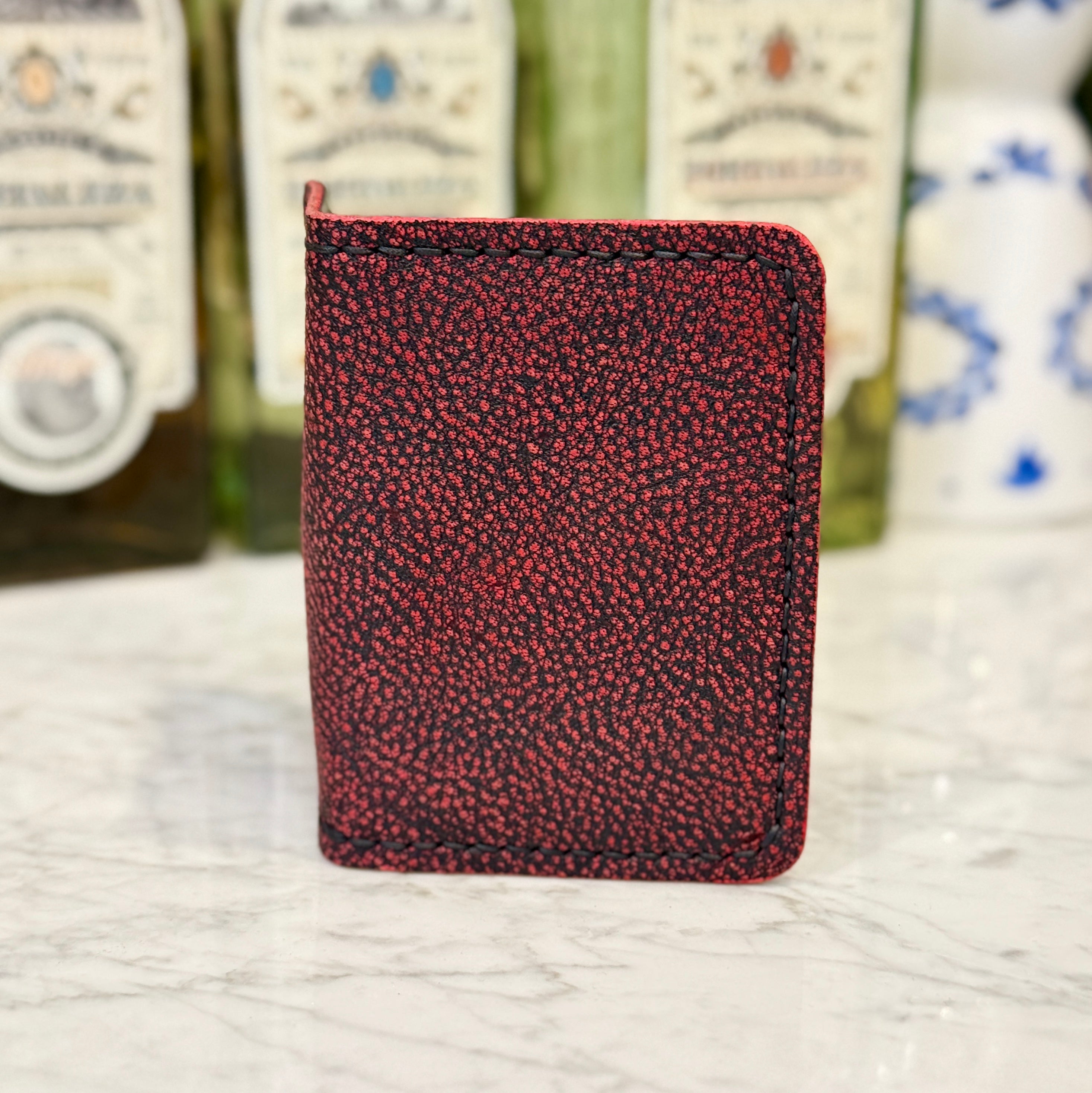 Red Giraffe JW Wallet by Toehold featuring a vibrant giraffe print and compact design for stylish everyday use.