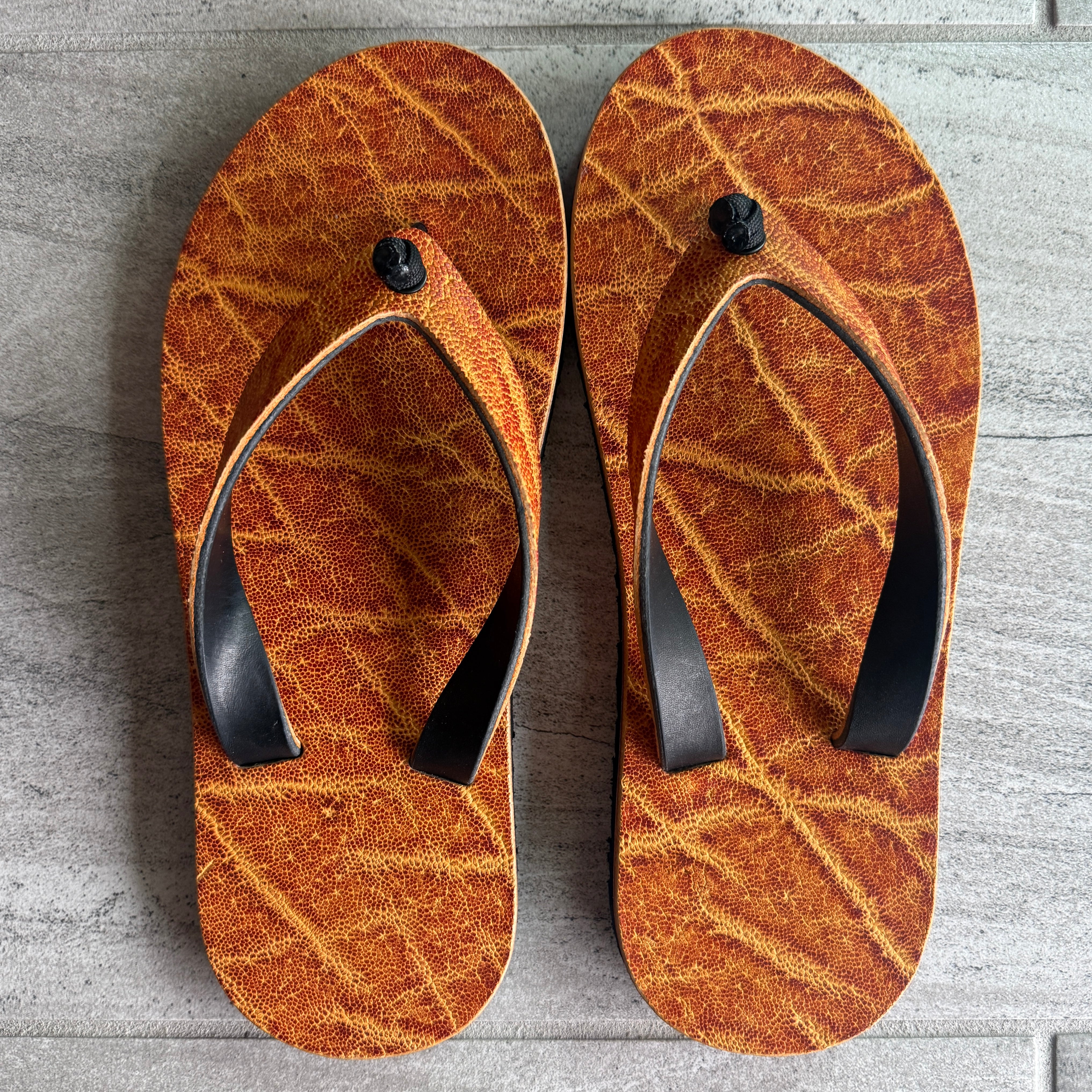 Toehold women's flip-flops with golden elephant design and matching straps, featuring a comfortable slip-on style.