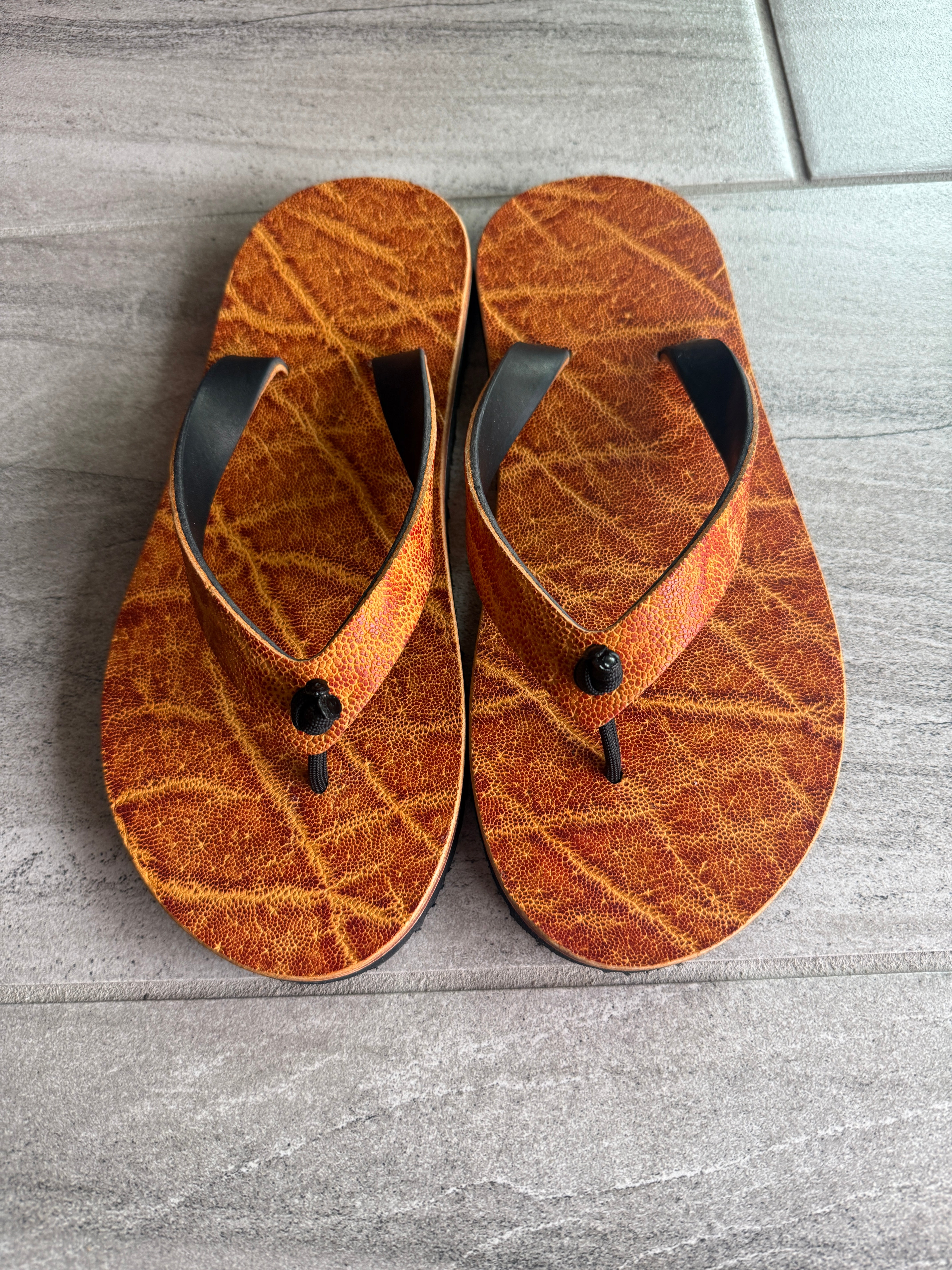 Toehold women's golden elephant flip-flops with matching straps, featuring a stylish and comfortable sandal design.